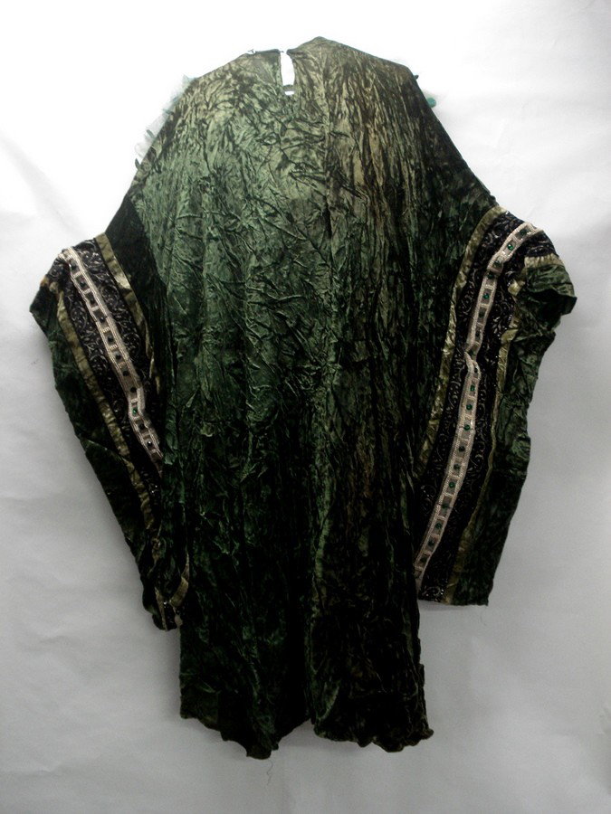 Stage costume - Edwardian style.: Stage costume - green velvet dress with long draped arms decorated with rhinestones and rows of small pearls. Attached green netted head piece with applied sequins. From the estate of Kermit Love, cos