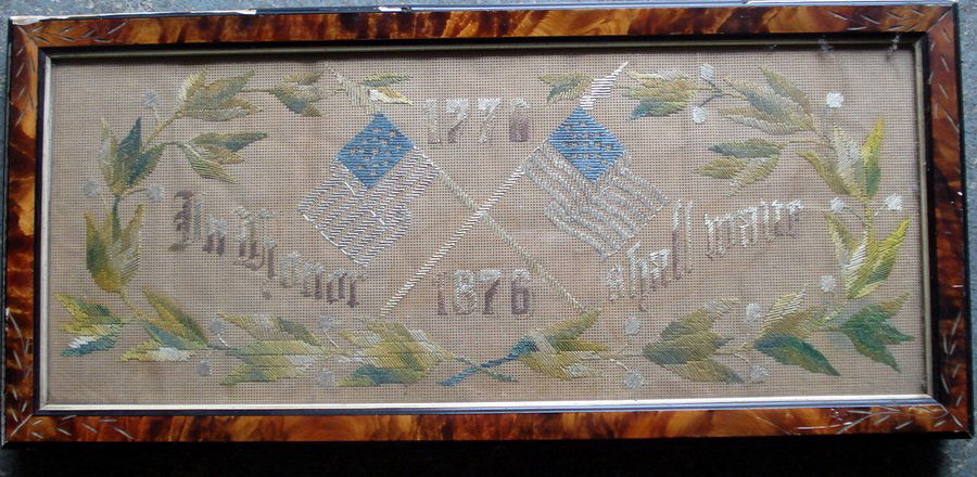 Centennial needlework "In Honour Shall Wave - 177: Centennial needlework "In Honour Shall Wave - 1776 1876" (phrase from the Star Spangled Banner) together with a needlework sampler that appears to be modern.