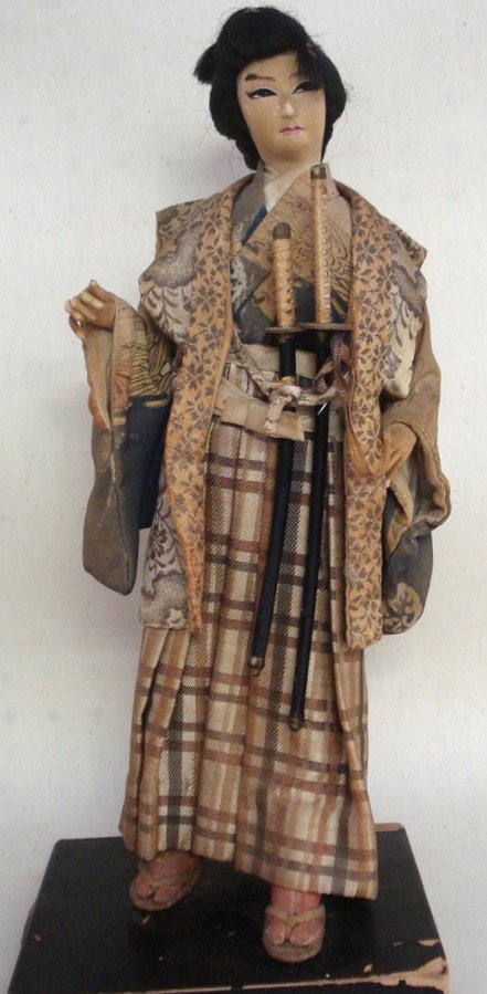 Old oriental doll in original costume with samuri: Old oriental doll in original costume with samurai swords - circa 1930-40. 16"H