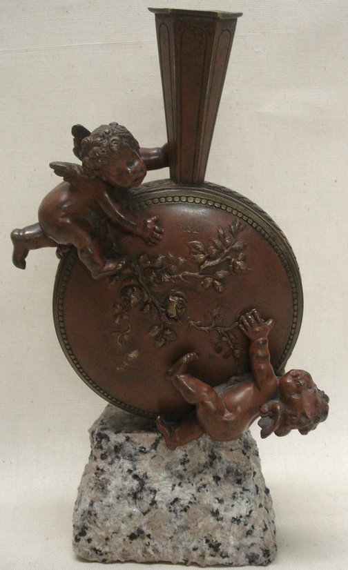 Bronze vase with 2 attached bronze cupids on grani: Bronze vase with 2 attached bronze cupids on granite base signed Auguste Moreau (France 1861- 1906) - Overall height on pedestal 10.25".