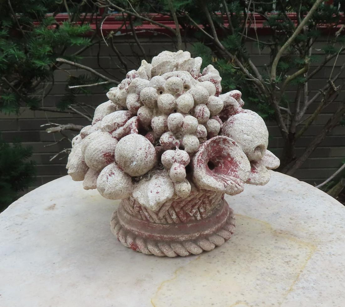 A cast stone garden ornament depicting a basket of fruit, early 20th century - several chips but (1 of 7)