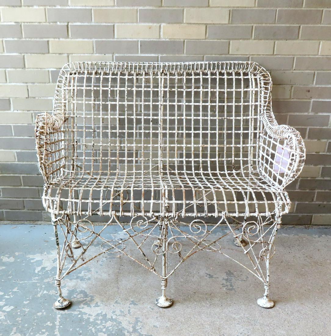 A Victorian wire garden settee in layers of old paint, 19th century, with original disk feet which (1 of 8)