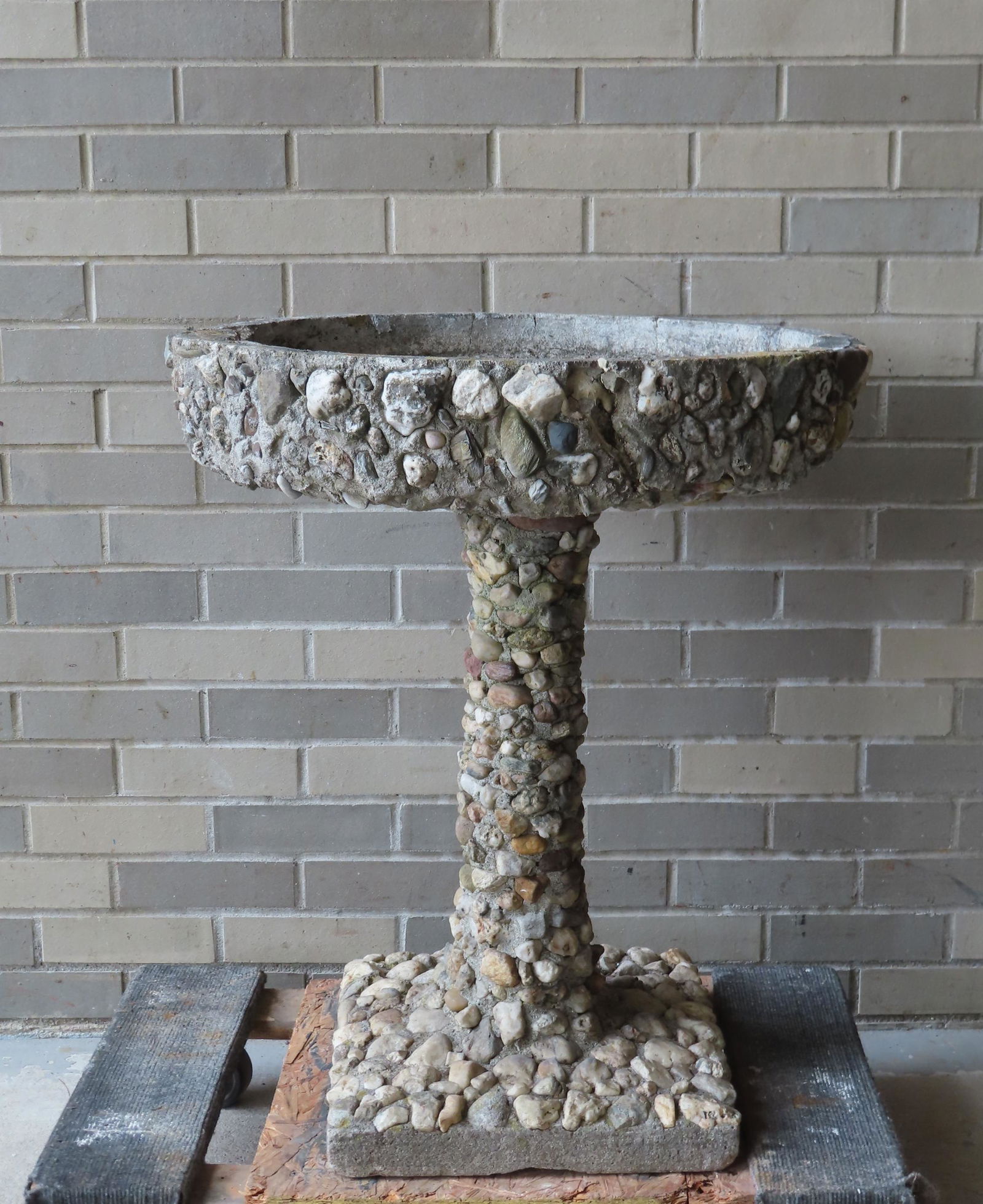 An old concrete and stone hand made bird bath - 1 piece construction. Missing several small stones (1 of 13)