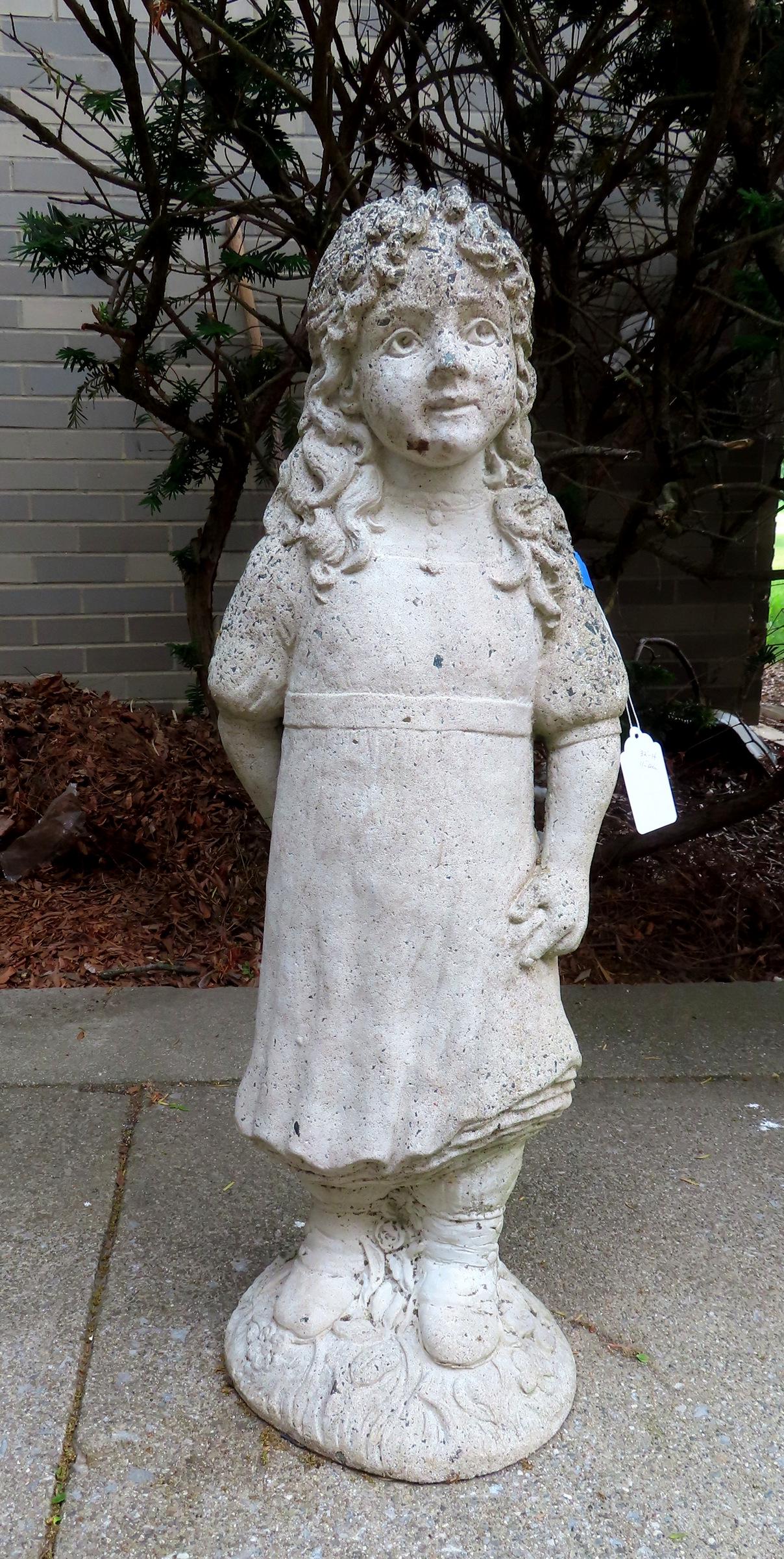 A concrete lawn statue of standing young girl holding flowers, signed and dated "1996 Nina Studio @ (1 of 5)
