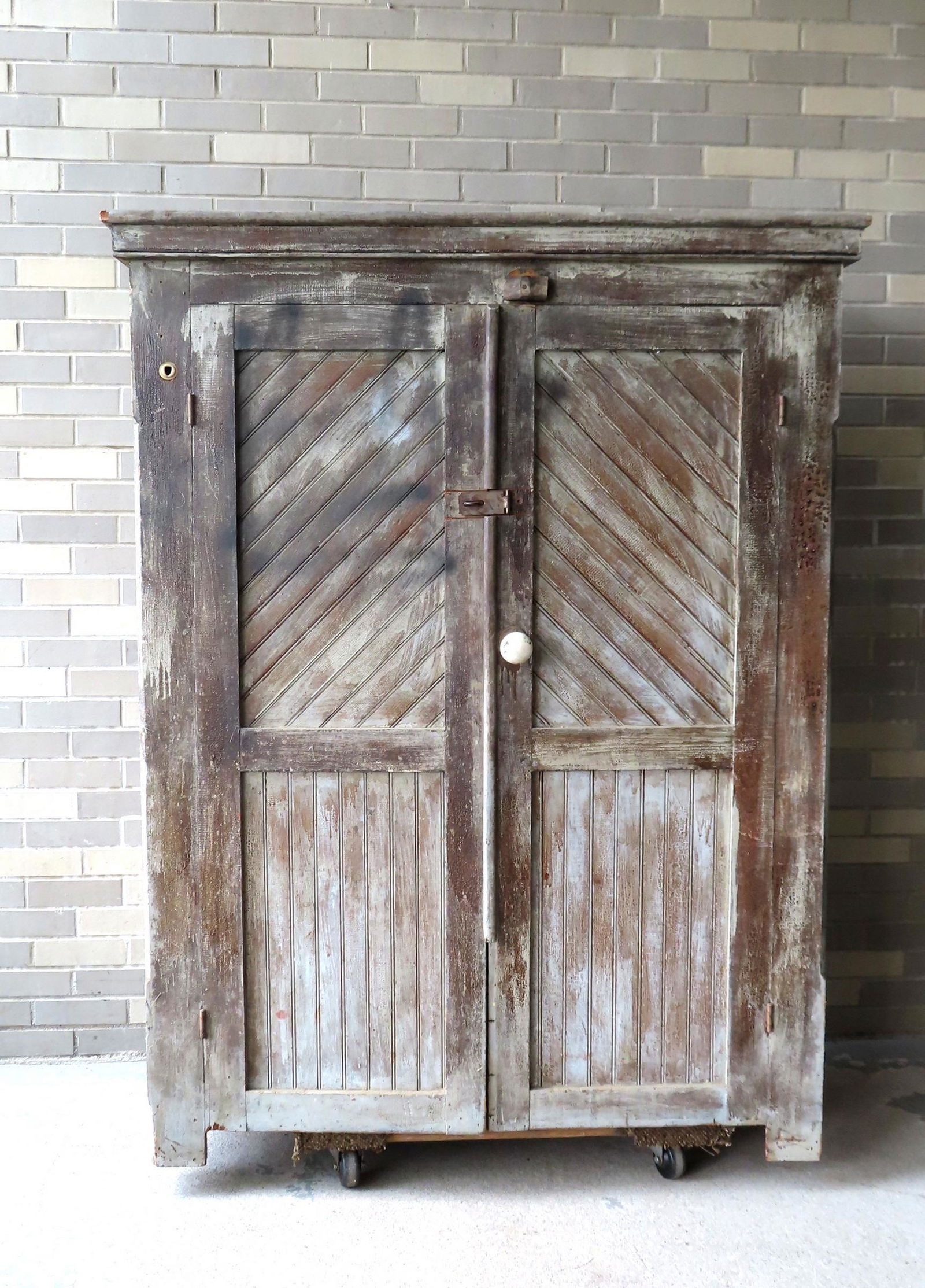 A primitive barn-found 2 door country cupboard in original paint, having paneled doors constructed (1 of 14)