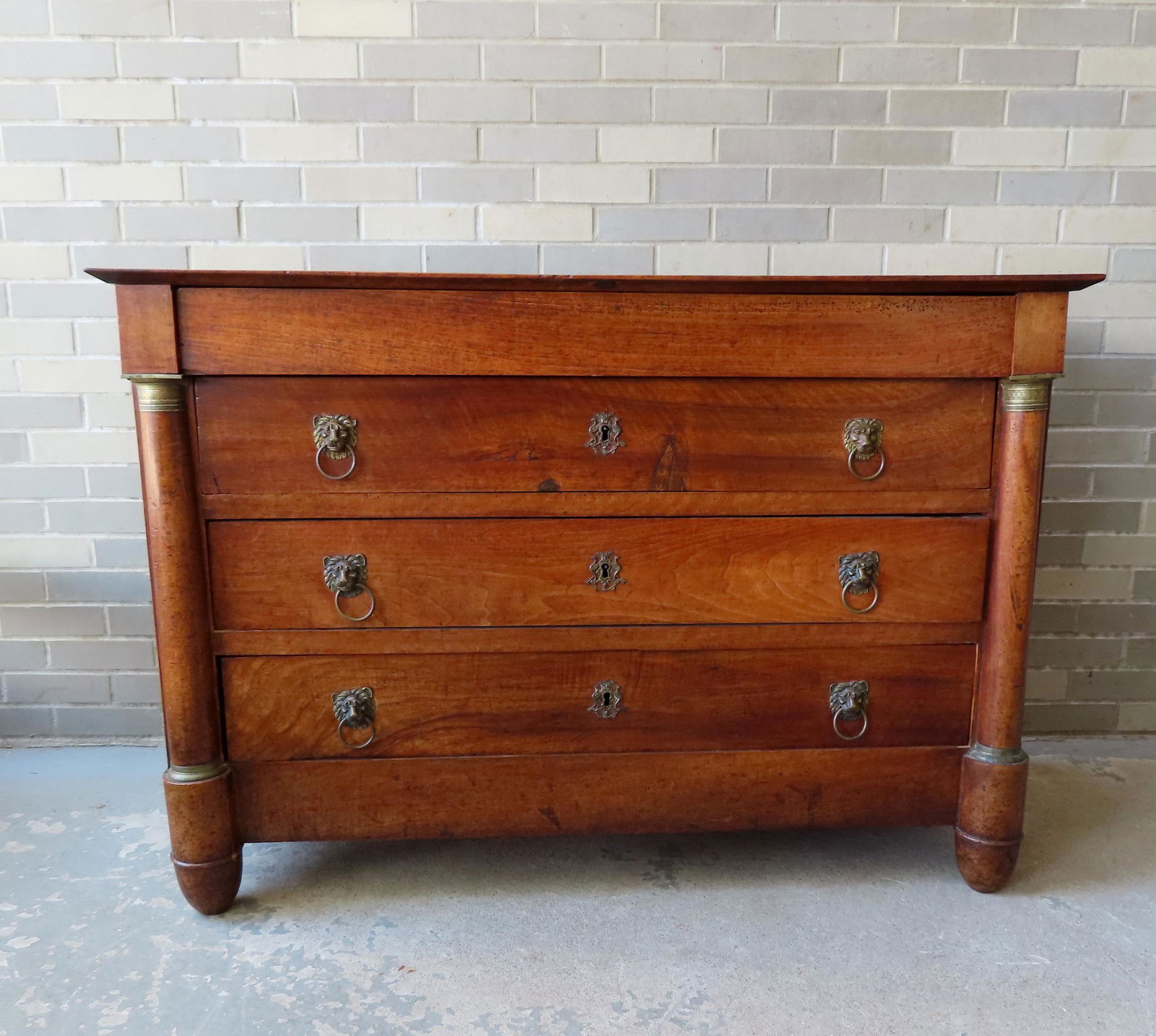 A classical Empire chest, possible French, early to mid 19th century, having 4 drawers, 1 a secret (1 of 15)