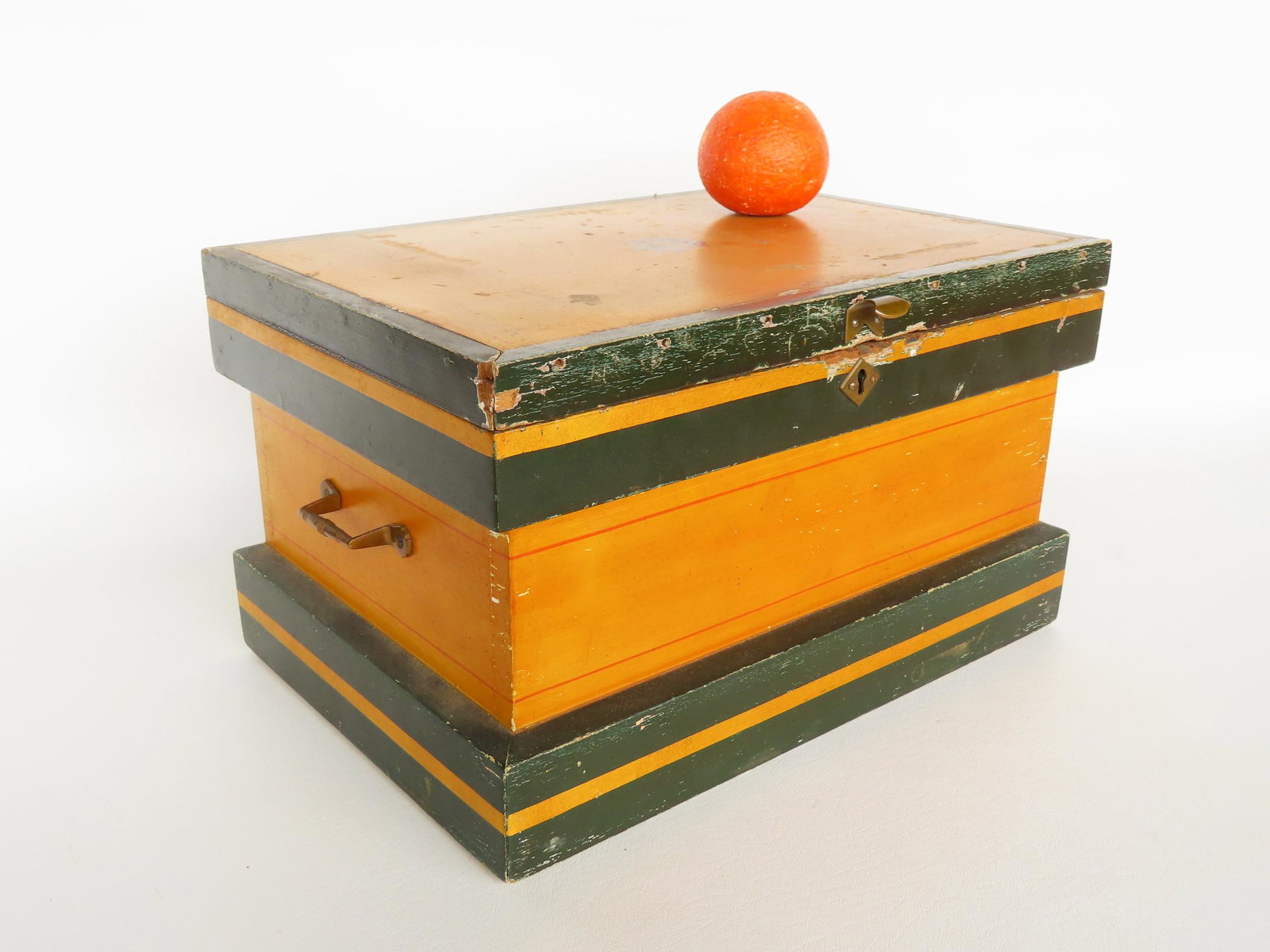 Small utility or sewing box in original mustard paint with red pin striping and brown highlights,: Small utility or sewing box in original mustard paint with red pin striping and brown highlights, circa 1870. Measures 15 3/4"W x 10 3/4"D x 9"H. Missing interior tray and missing hasp, otherwise very