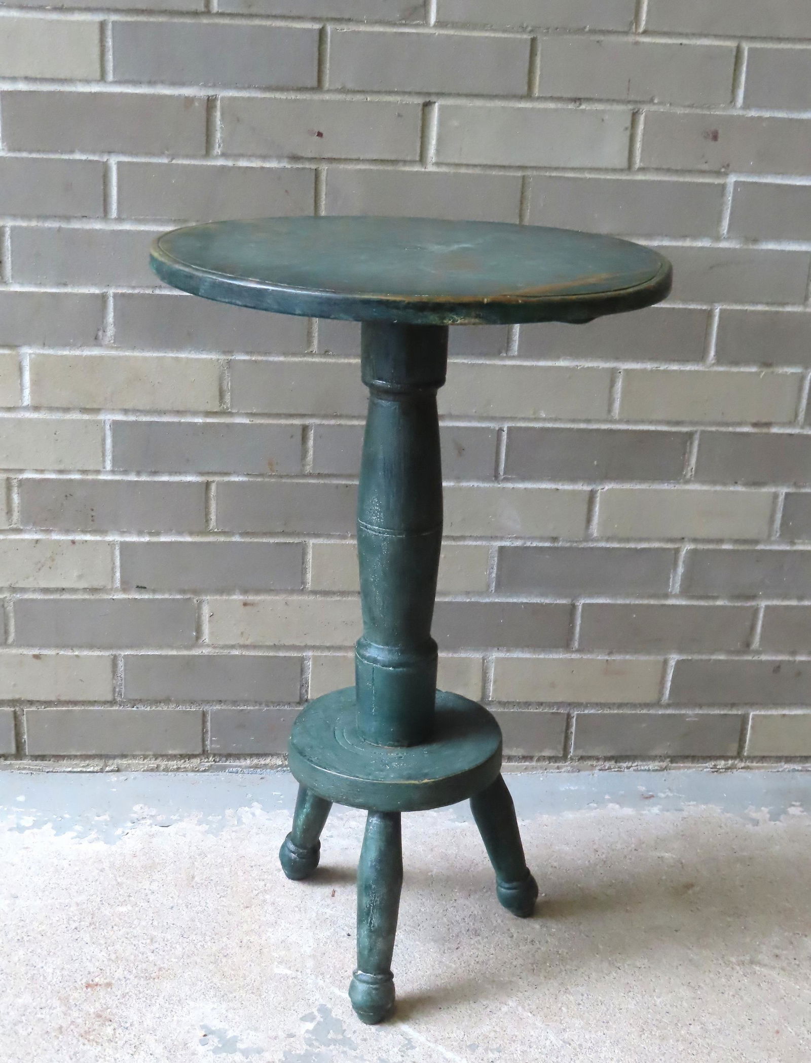 A custom made primitive 18th century style candlestand in green paint, having a circular top, turned (1 of 6)