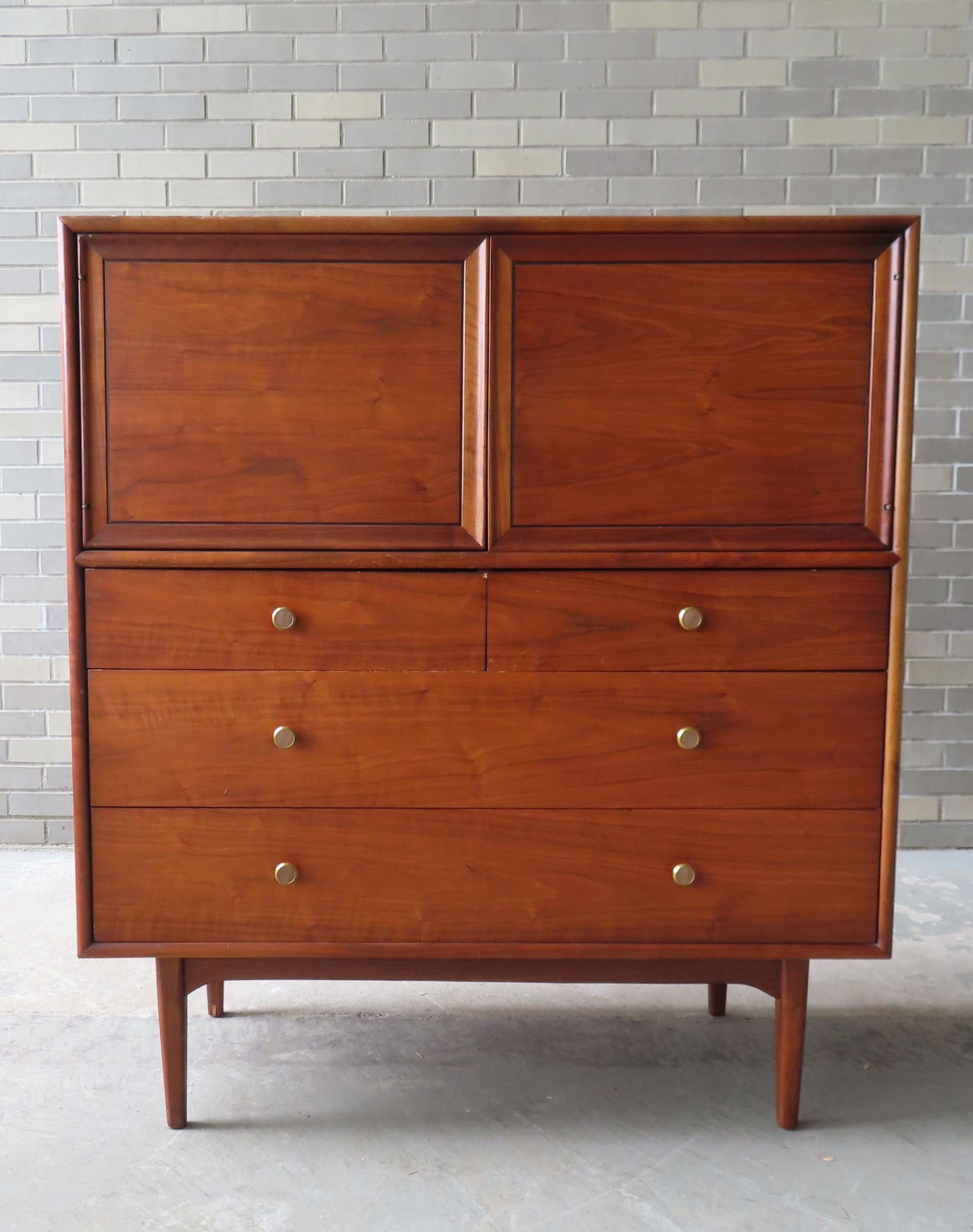 A Danish modern cherry gentleman's chest designed by Kipp Stewart, having 2 doors with 4 interior (1 of 12)