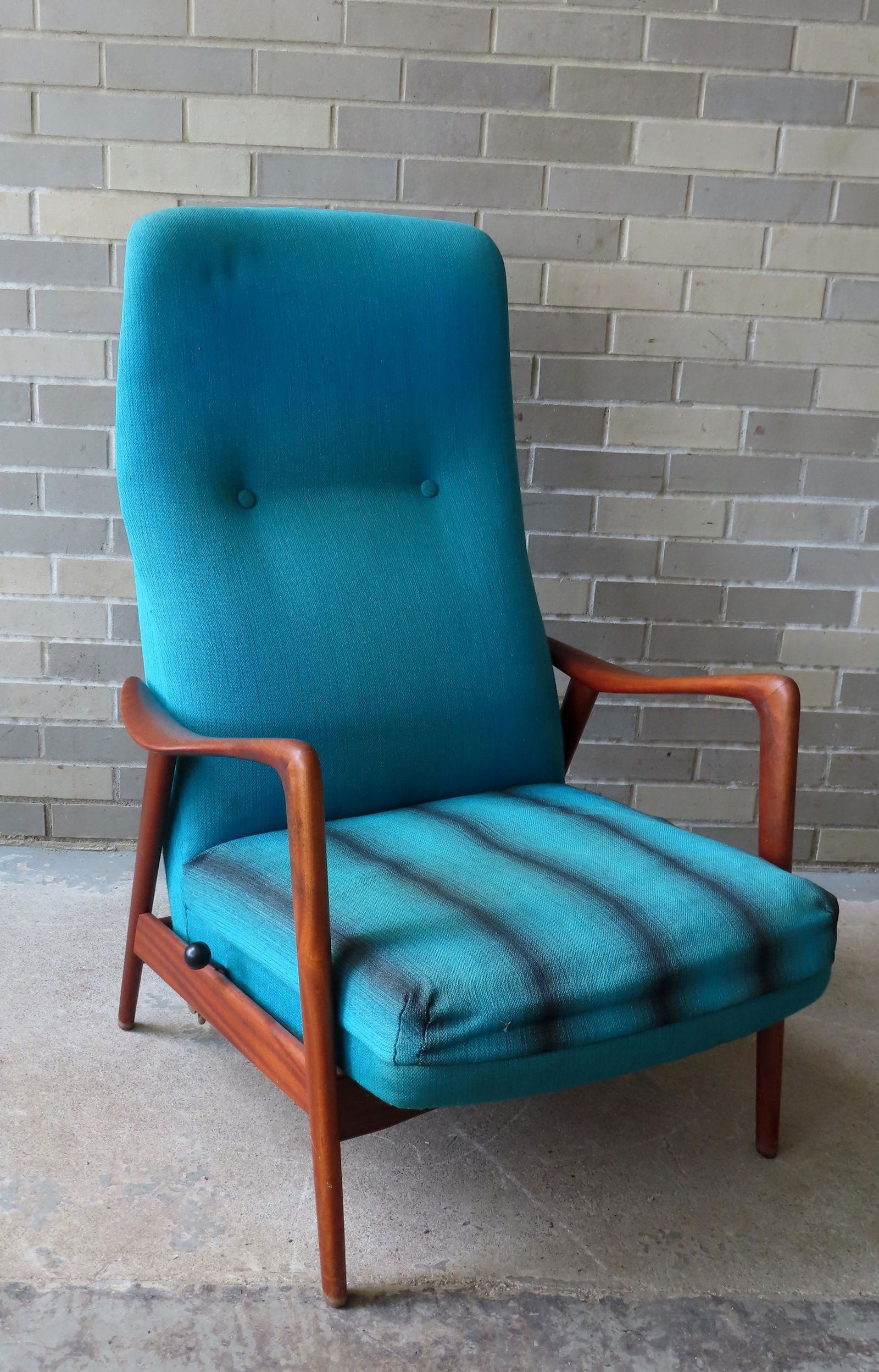 A Scandavian high back lounge chair/recliner in teakwood by Arnt Lande, signed with an "A" on the: A Scandavian high back lounge chair/recliner in teakwood by Arnt Lande, signed with an "A" on the underside - appears to retain original fabric. Handle on the side for back adjustment. Overall very go