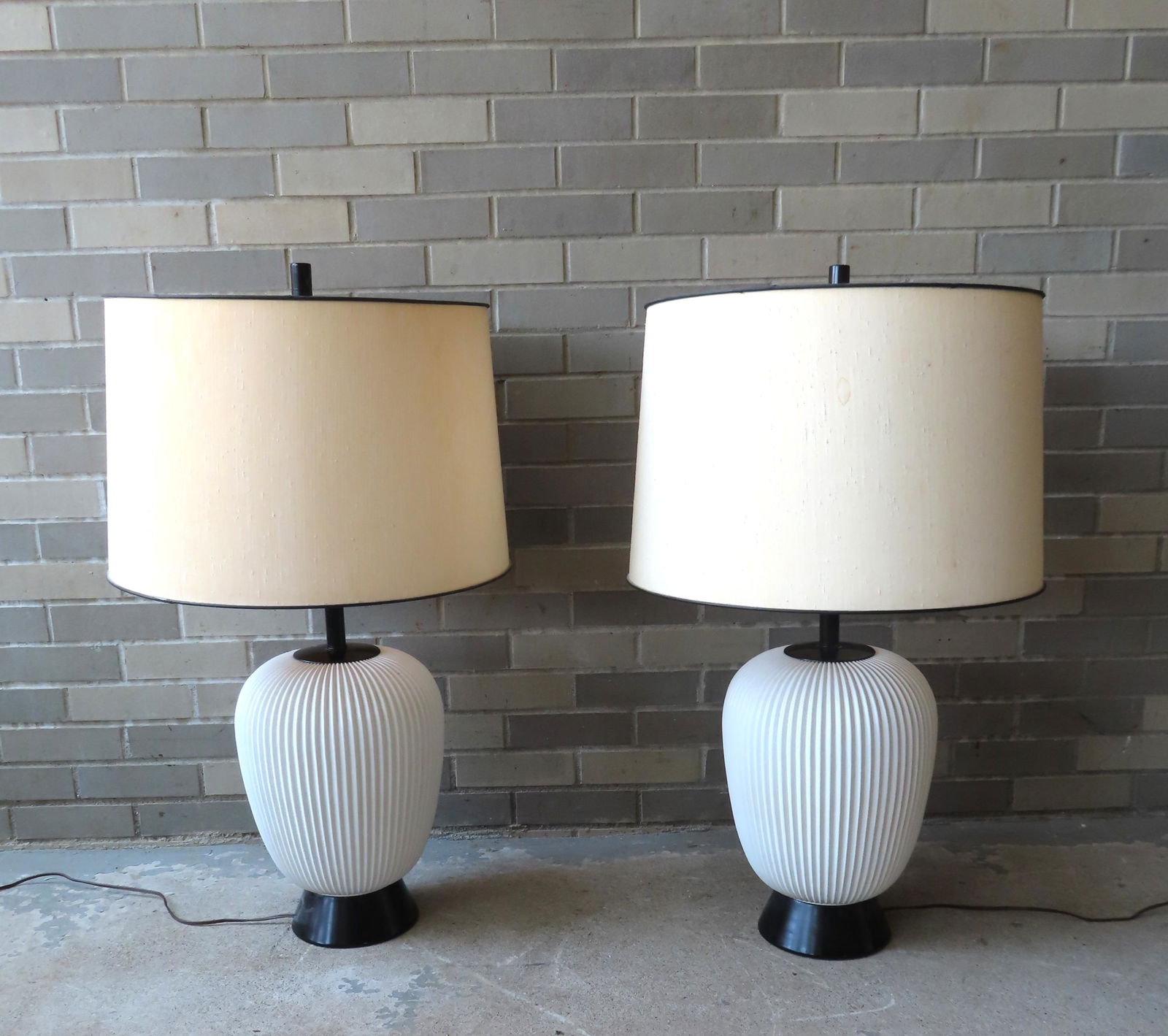 A pair of mid century modern fluted white glass table lamps, not signed, circa 1960-70. Both have (1 of 5)
