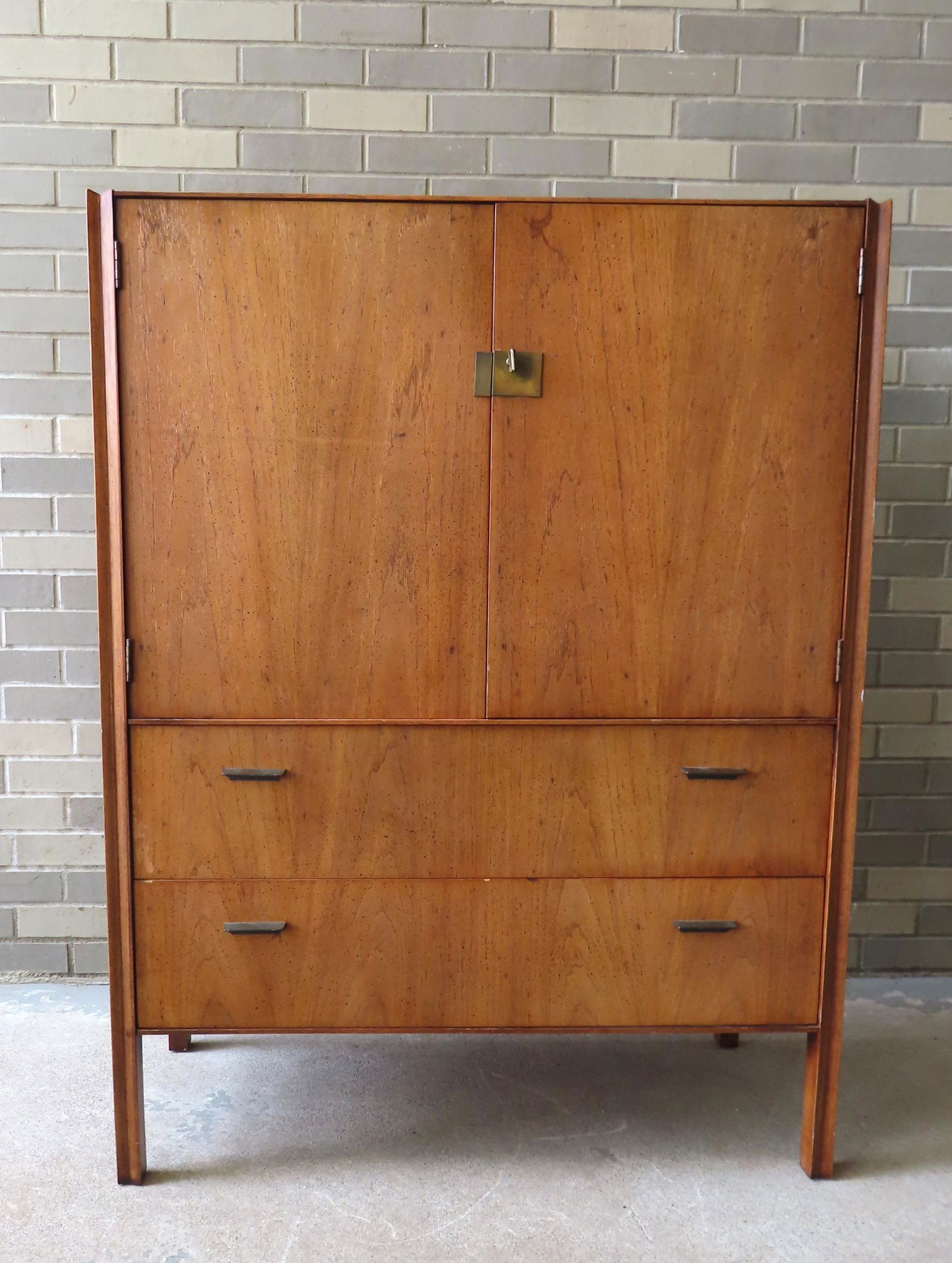 A Danish modern gent's wardrobe having 2 doors with 2 interior drawers over 2 drawers, some use wear (1 of 6)