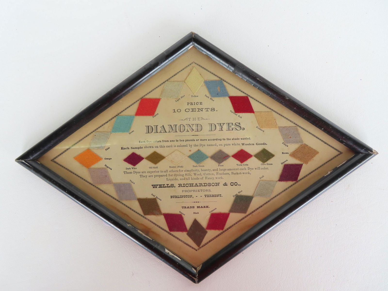 A "Diamond Dyes" framed fabric color chart in diamond shape marked "Price 10 Cents / Wells, (1 of 3)