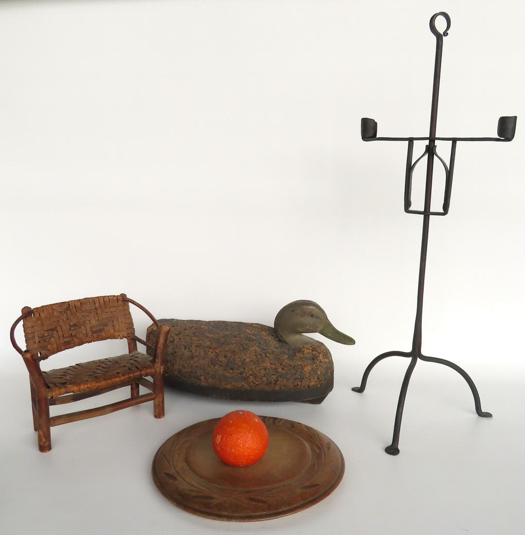 A grouping of 4 country items including: A cork black duck decoy, a carved wooden bread cutting (1 of 16)