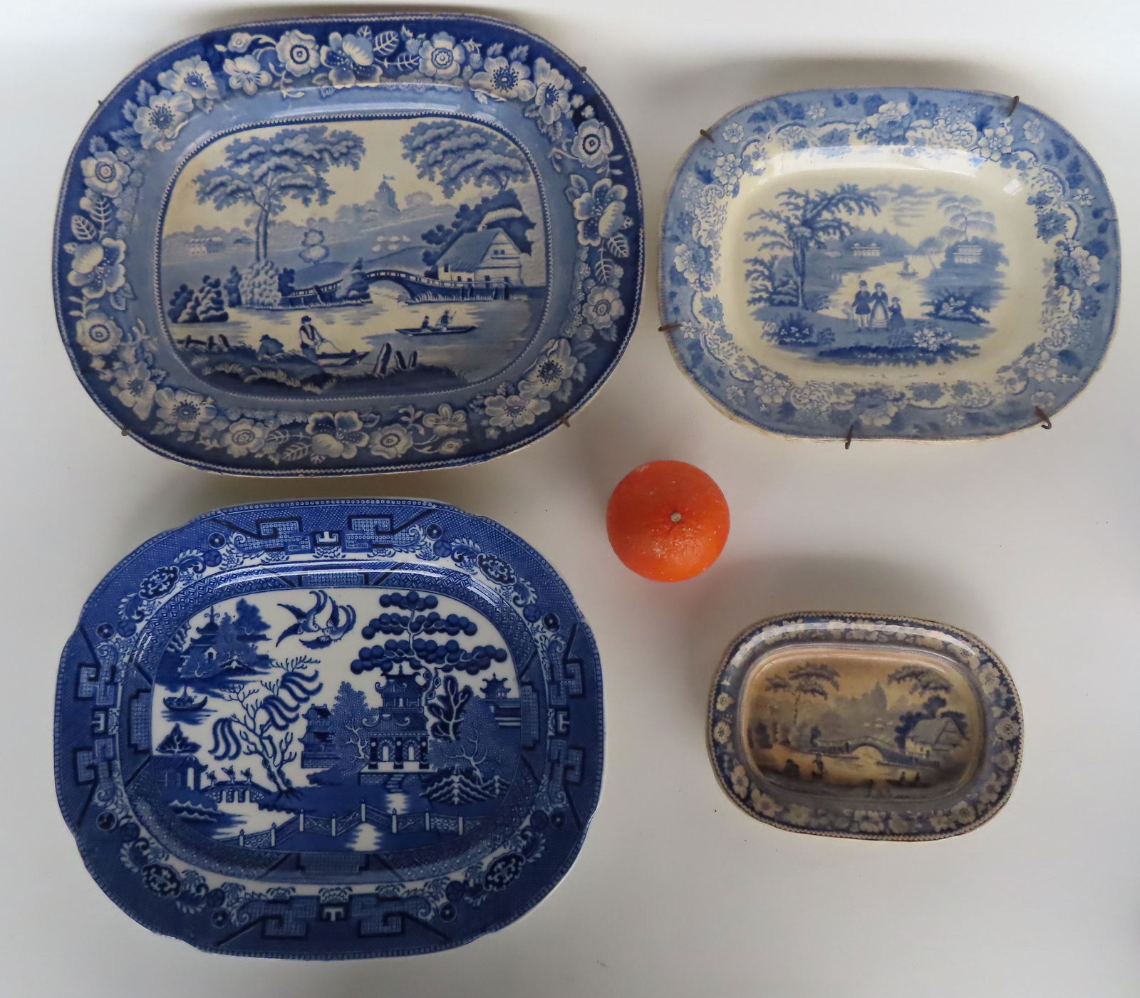 Grouping of 4 transferware blue and white platters including: The largest a Staffordshire platter (1 of 9)