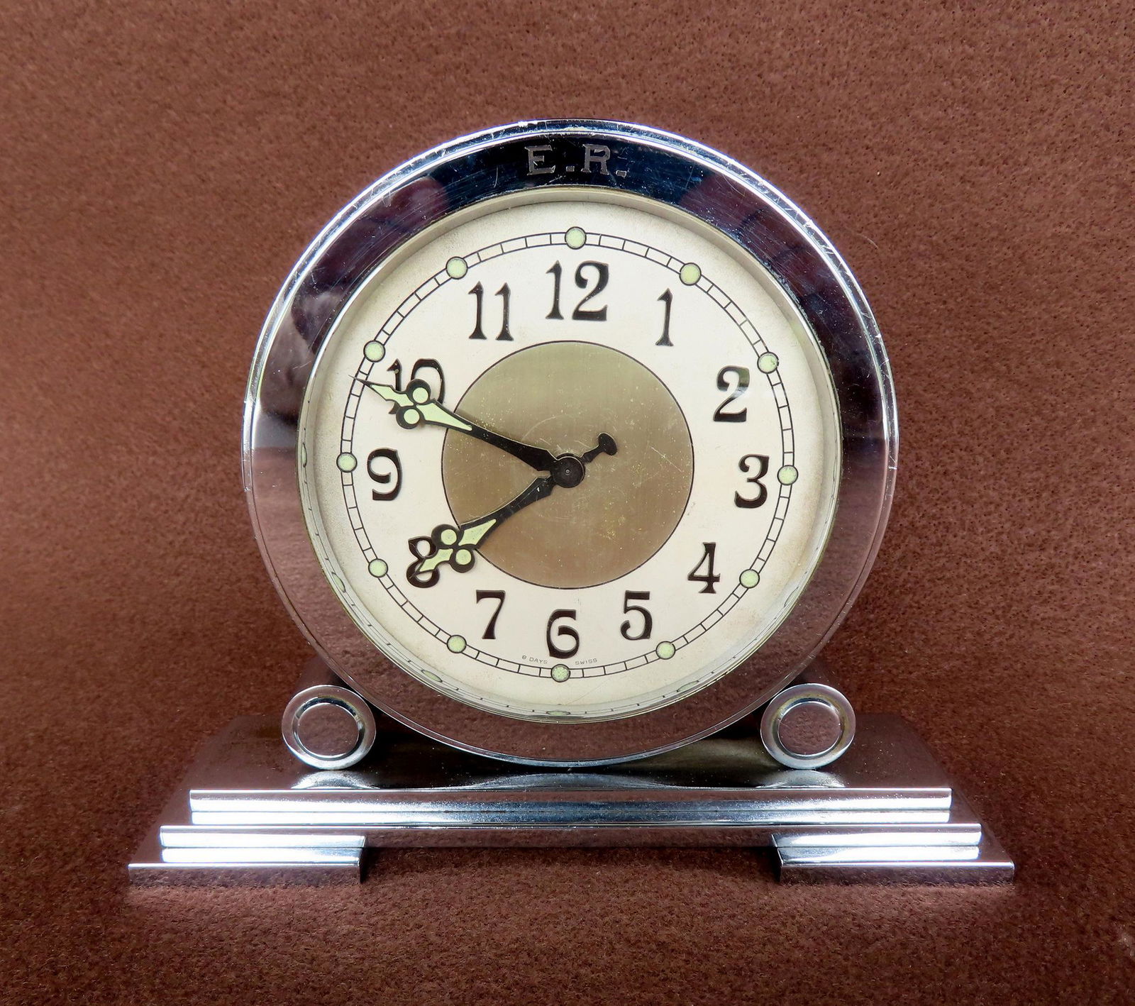 A small polished steel double sided Swiss dresser clock in the Art Deco style, circa 1930-50. The (1 of 2)
