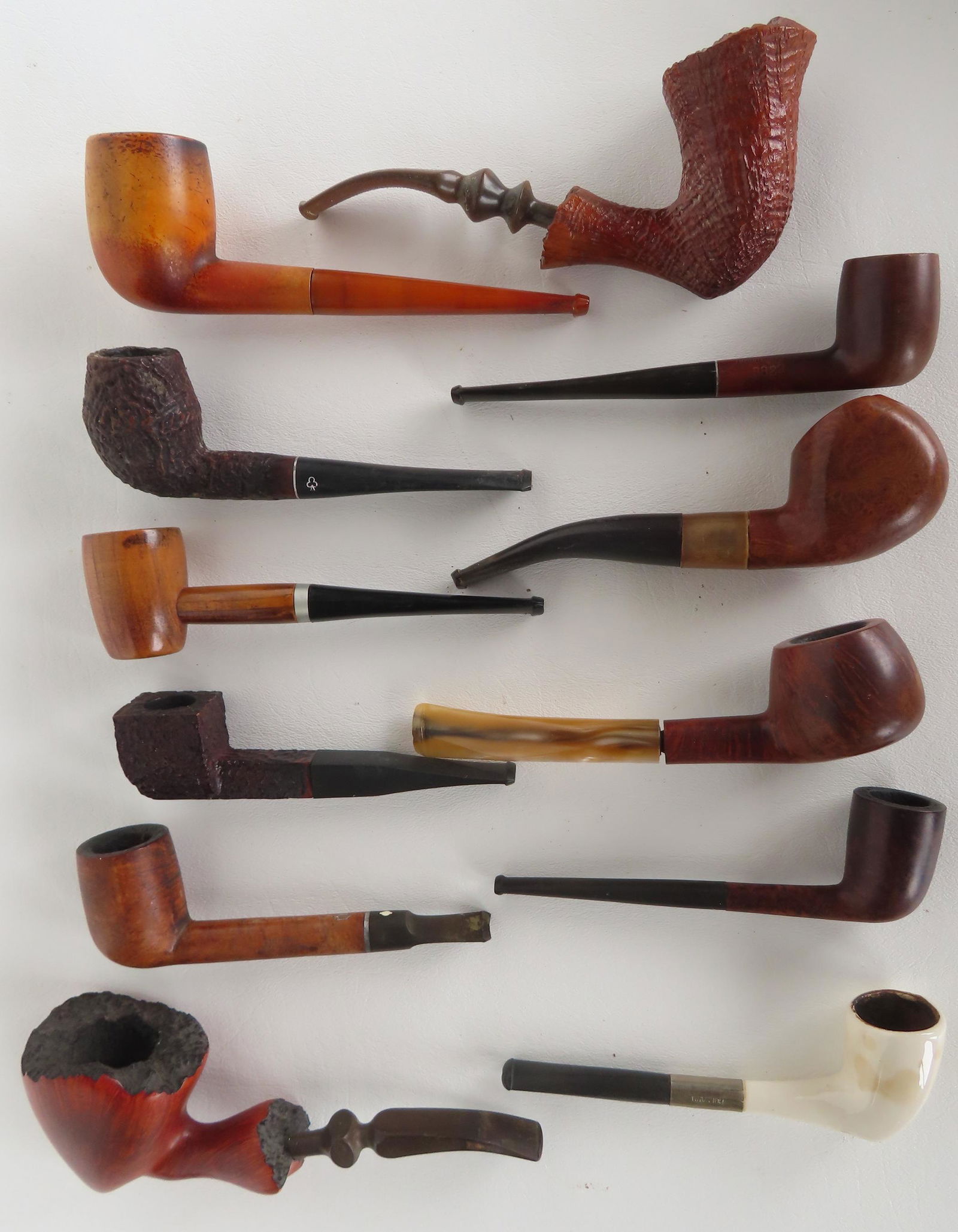 A grouping of 12 smoking pipes, most with wooden bowls. Most signed including "Knute of Denmark", (1 of 4)