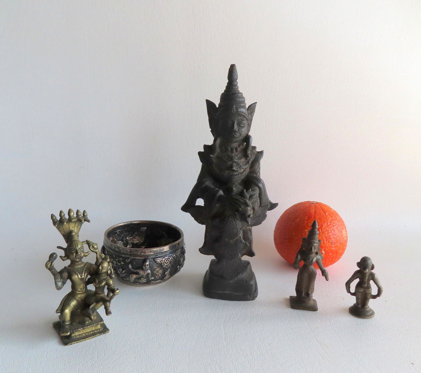 Grouping of Indian metal objects including: The largest, a bronze sculpture of an Indian god, (1 of 13)