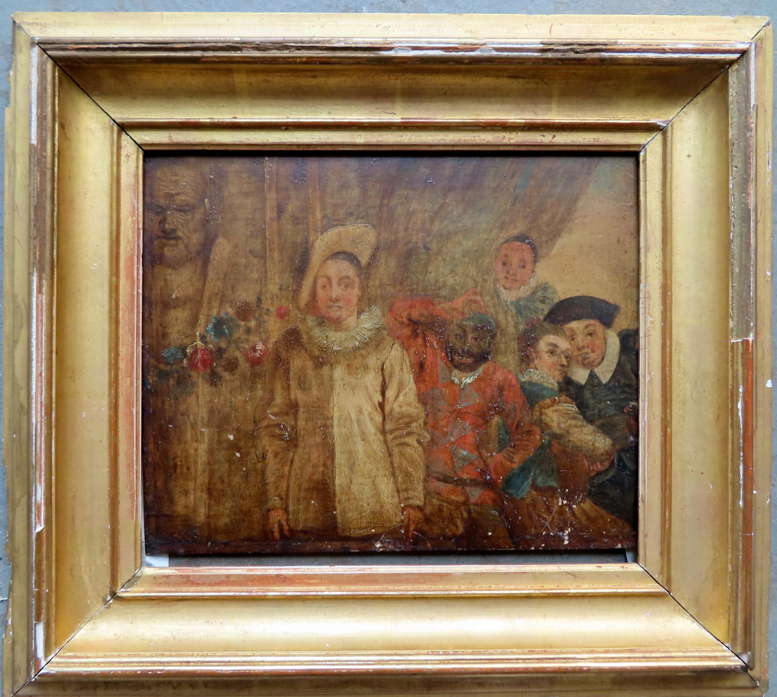 Oil on oak panel depicting portrait of a jester with other figures including an African American: Oil on oak panel depicting portrait of a jester with other figures including an African American man, late 17th to early 18th century housed in a period lemon gold frame - darkened varnish surface wit