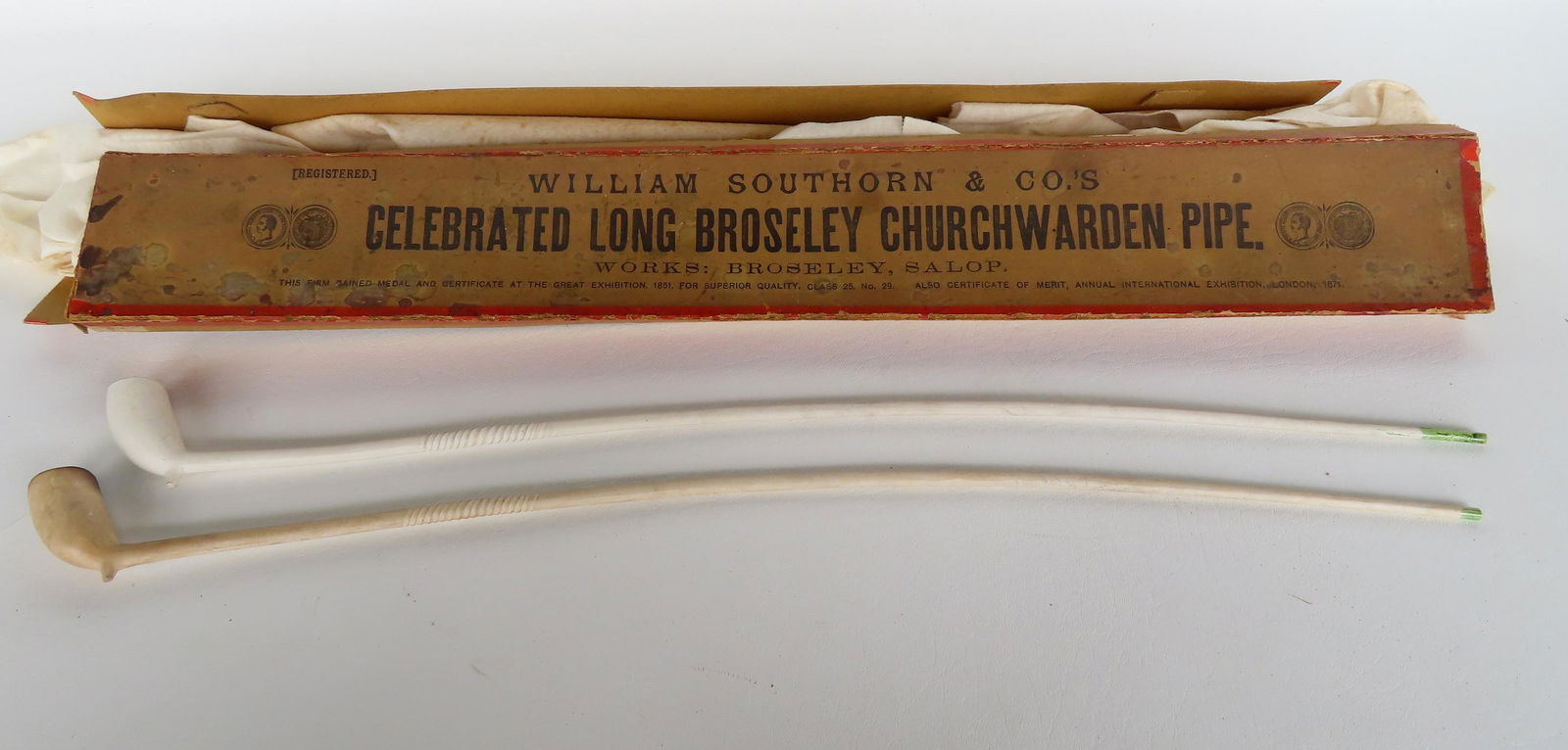 Two  long clay pipes in original box marked "William Southorn & Co.'s / Celebrated Long Broseley (1 of 10)