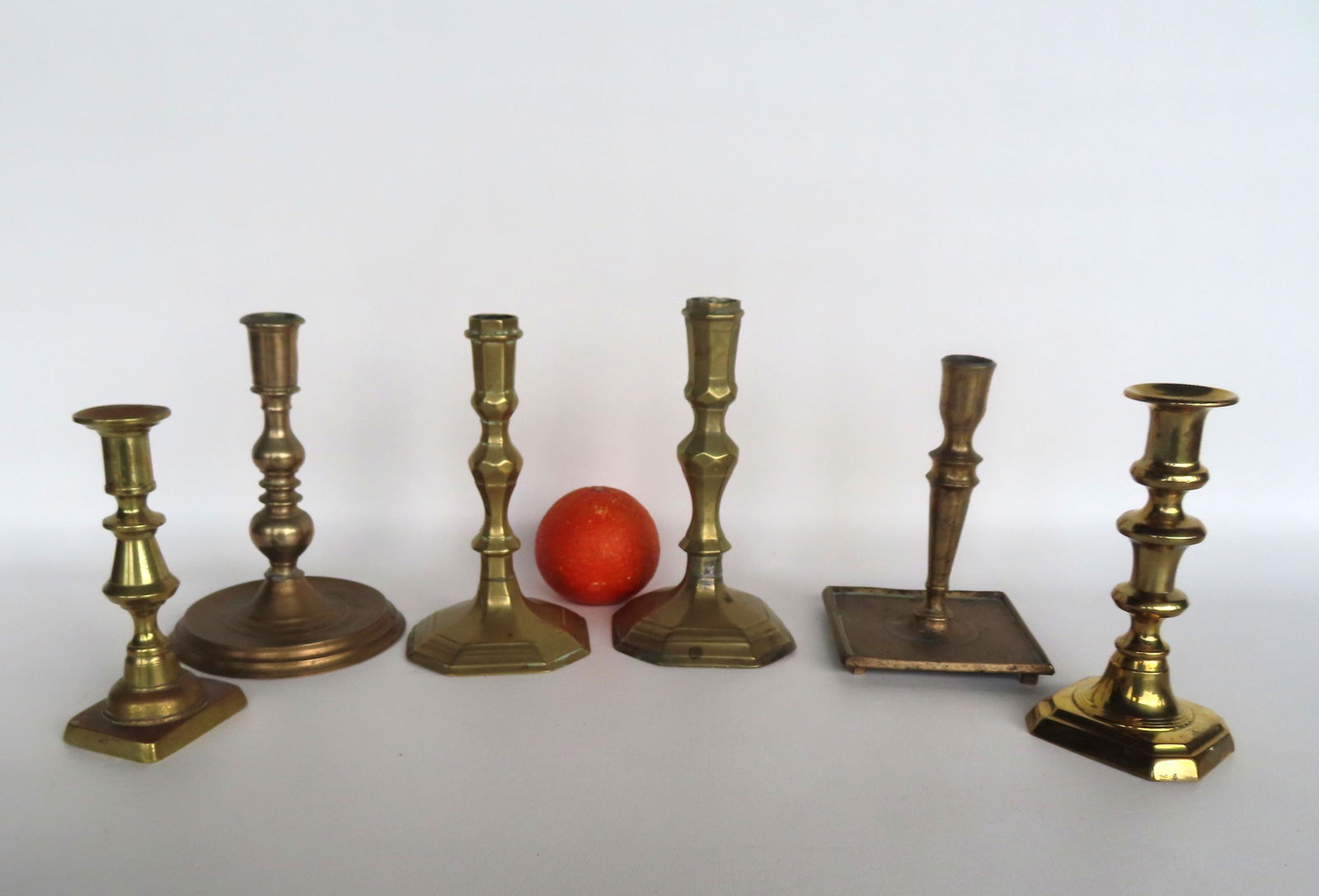 Grouping of 6 early brass candlesticks, all 18th to mid 19th century. Two near matching early 18th (1 of 11)
