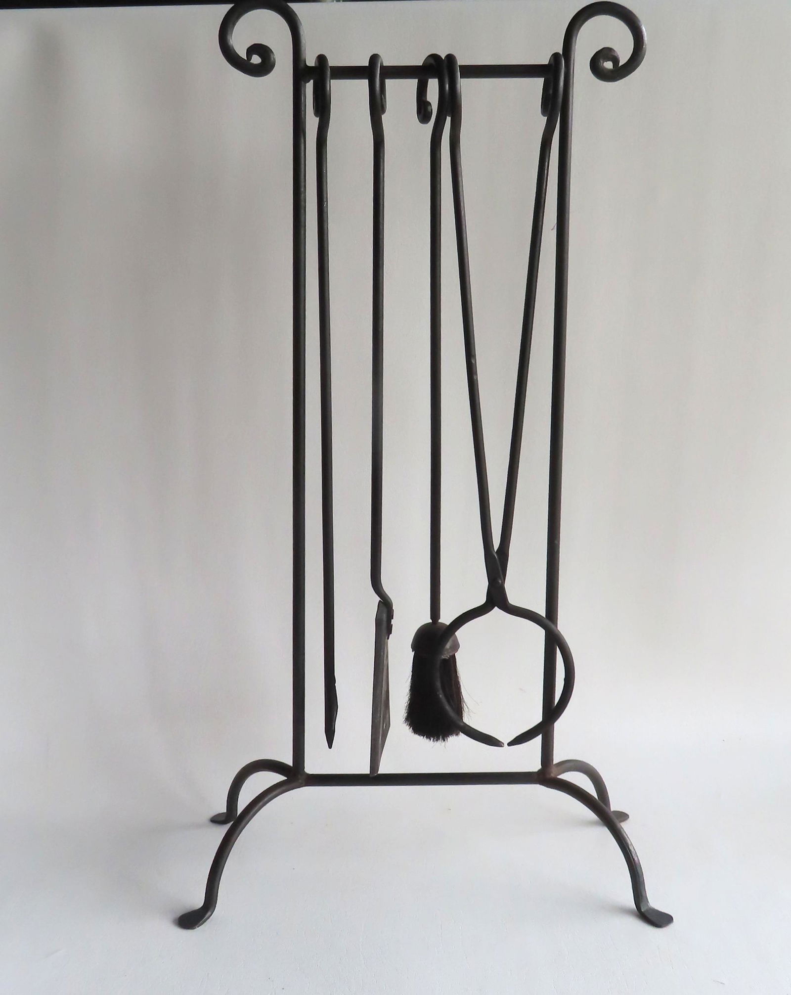 A set of Arts & Crafts style iron fireplace tools with holder, circa 1930-50. (1 of 4)