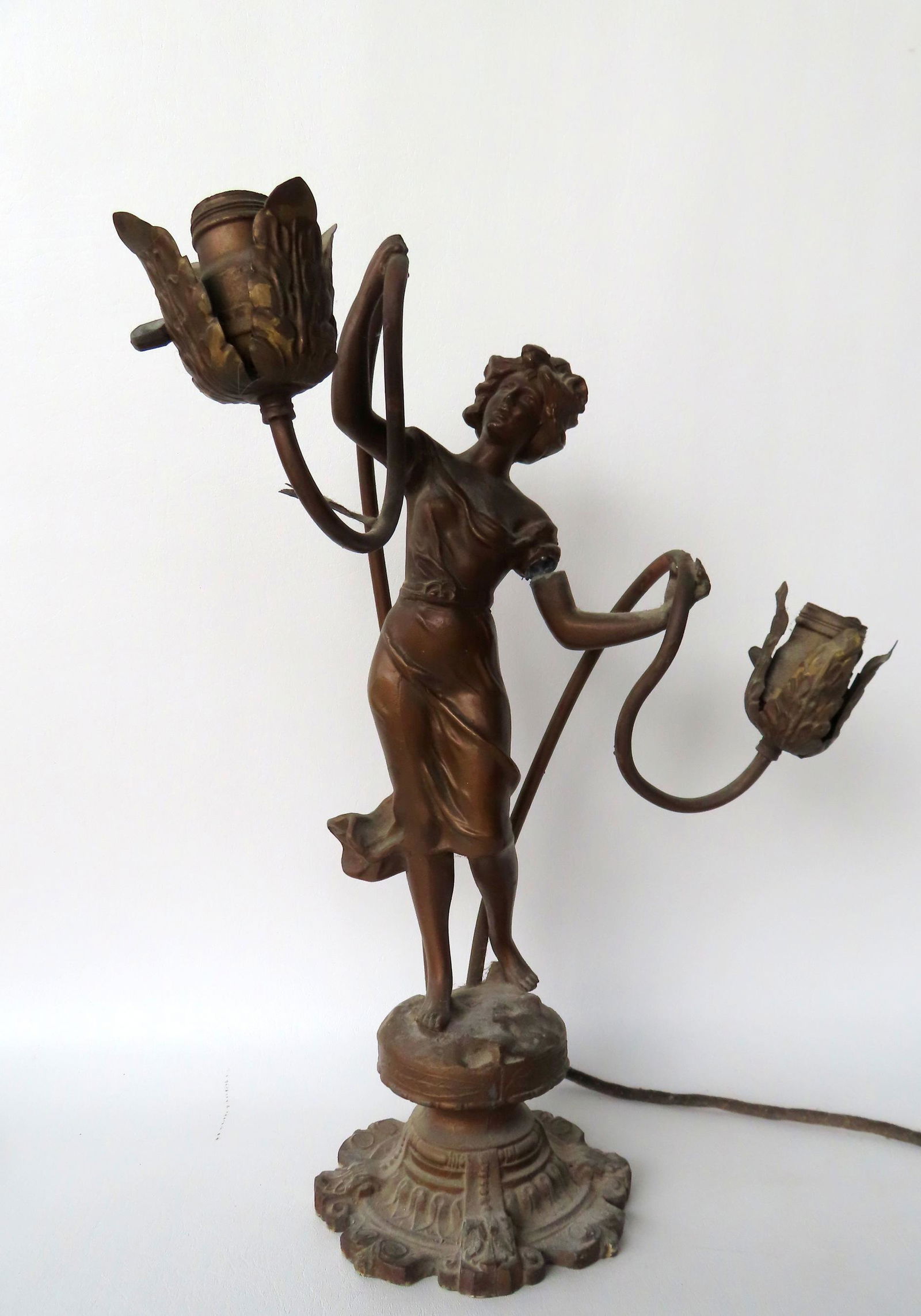 An ornate white metal table lamp in the form of a classical lady holding the arms leading to 2 (1 of 10)
