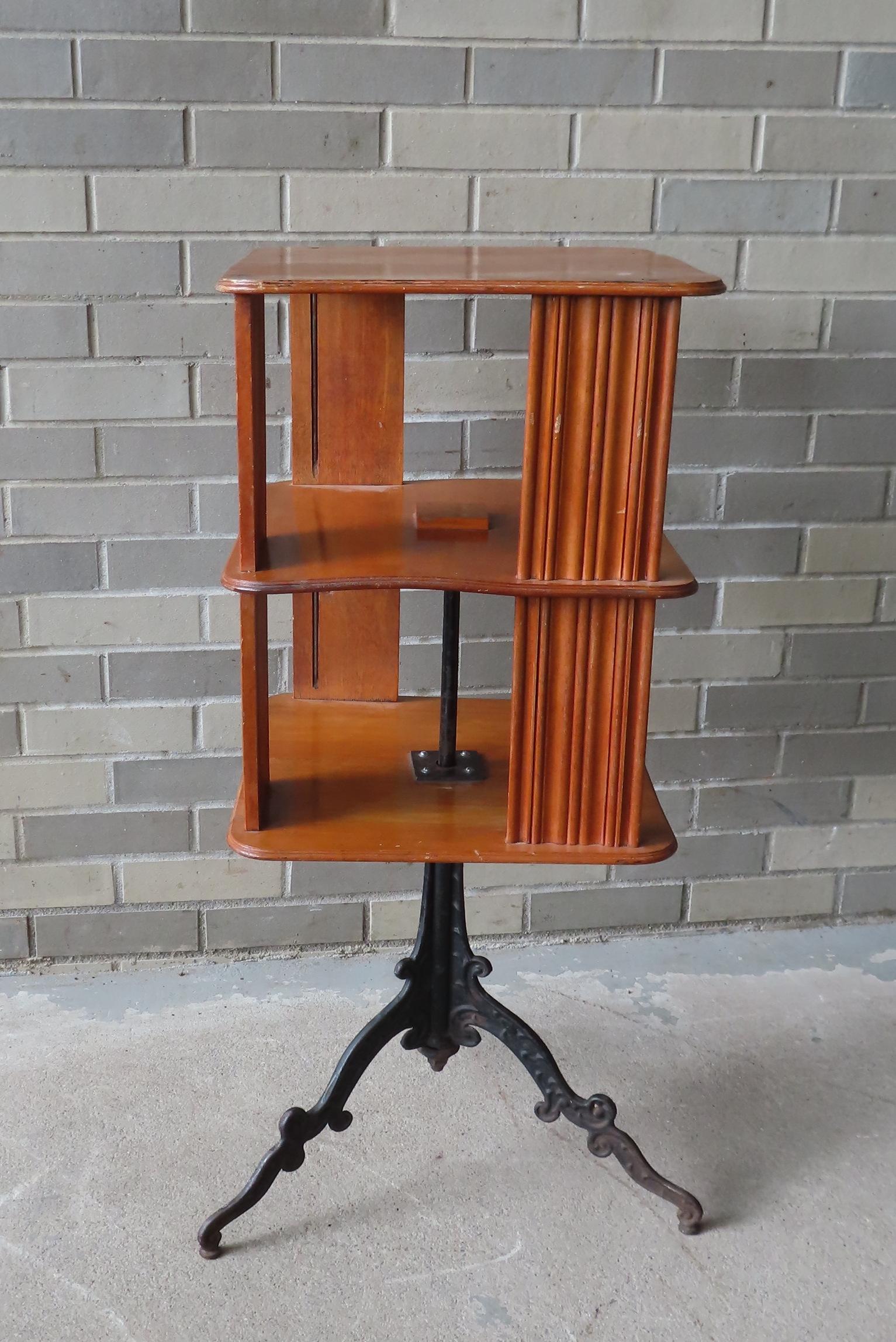A revolving birch wood book stand mounted on tri-leg cast iron base. (1 of 7)