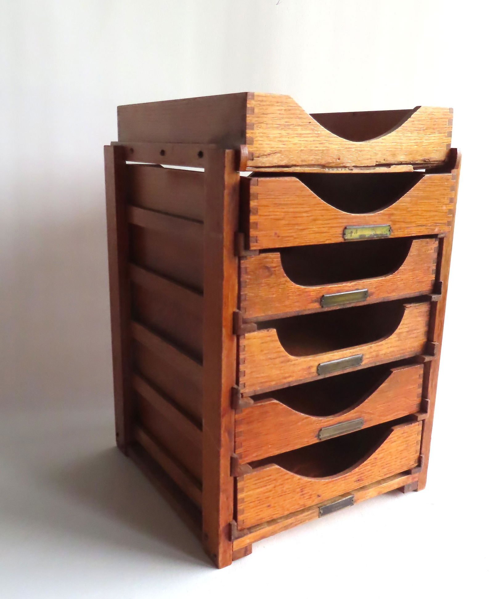 An oak table top file cabinet with 5 removable drawers and non-removable top platform in the form of (1 of 5)