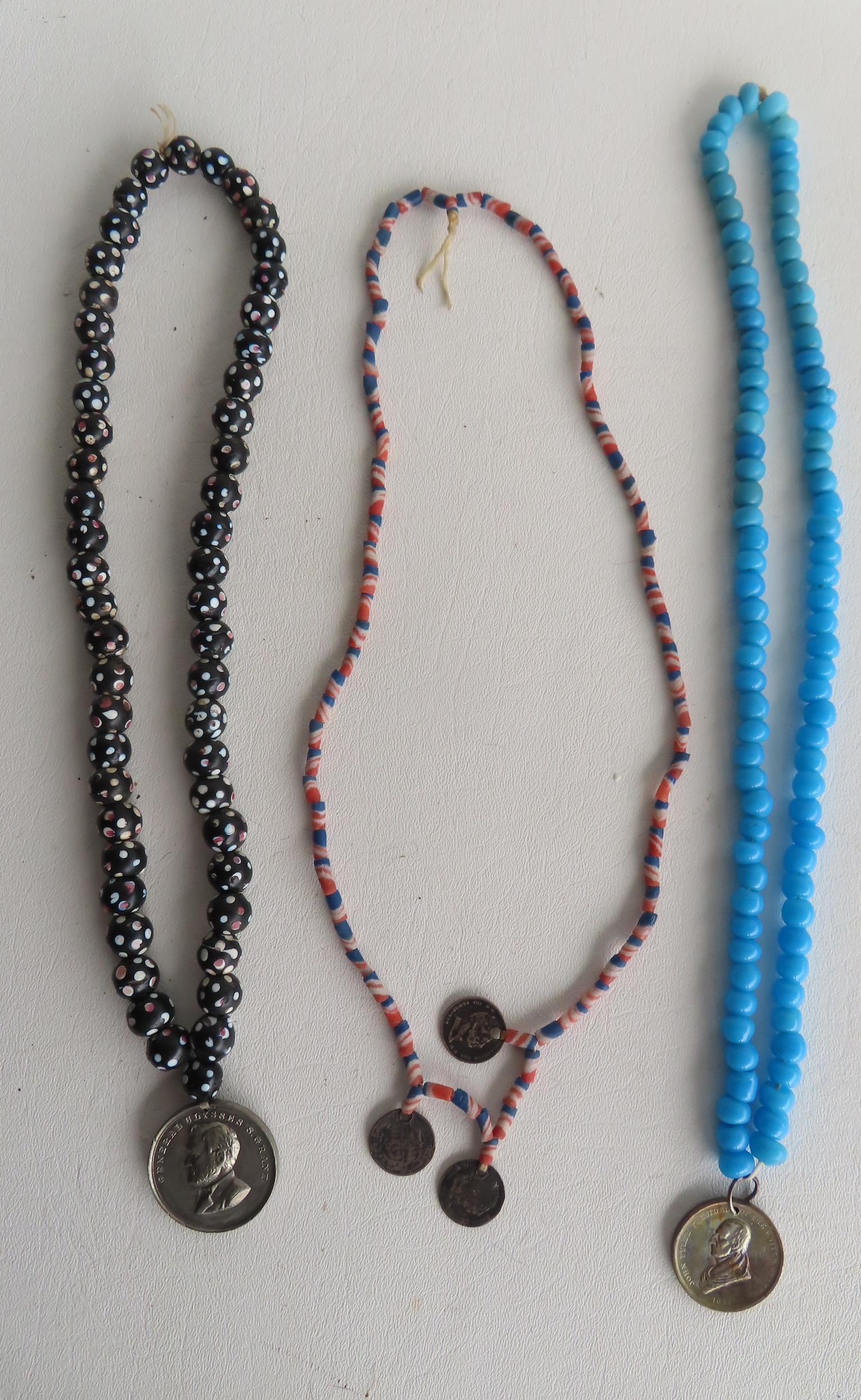 Three Native American stone peace medal necklaces, all with medallions, mid to late 20th century. (1 of 3)