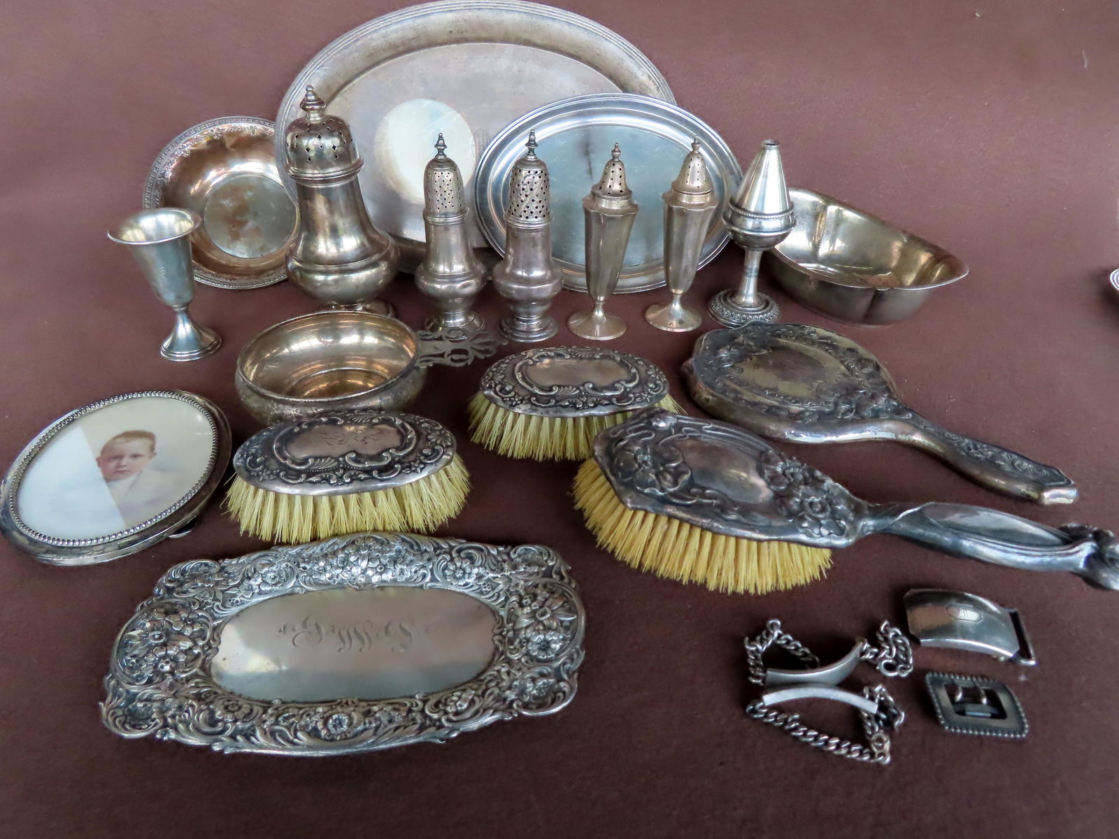 A grouping of sterling silver, including small platters, cup, a small repousse floral tray, early (1 of 9)