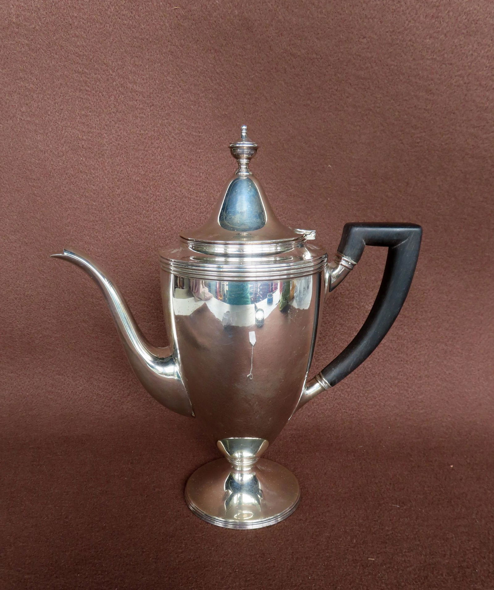 A signed "Tiffany & Co. Makers" sterling silver teapot measuring 10 1/2"H x 10"W - has a black (1 of 5)