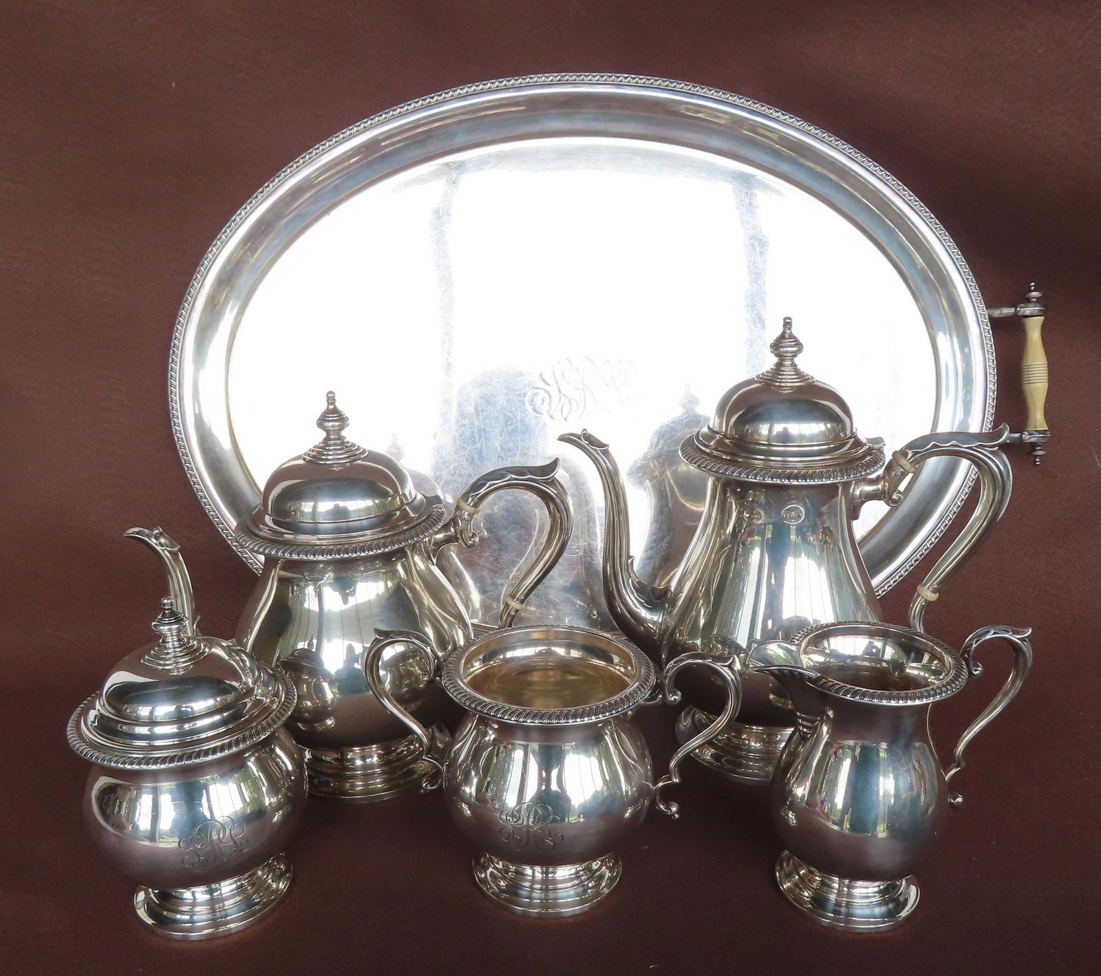 A sterling silver tea service signed Fisher in the "Kent" pattern. Each piece with engraved (1 of 17)