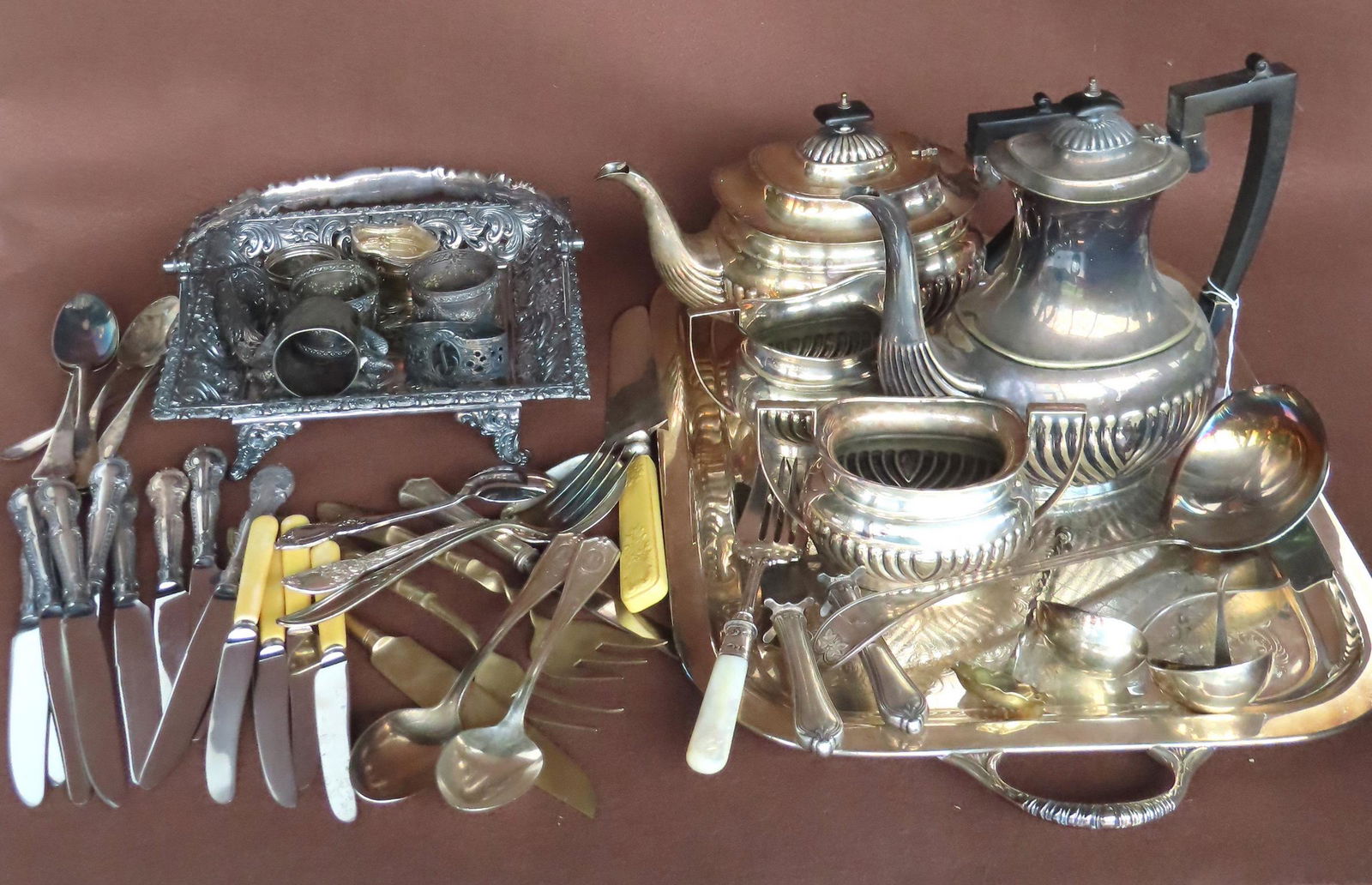 Grouping of mostly silver plate and unmarked silver including: Victorian figural silver plate napkin (1 of 12)