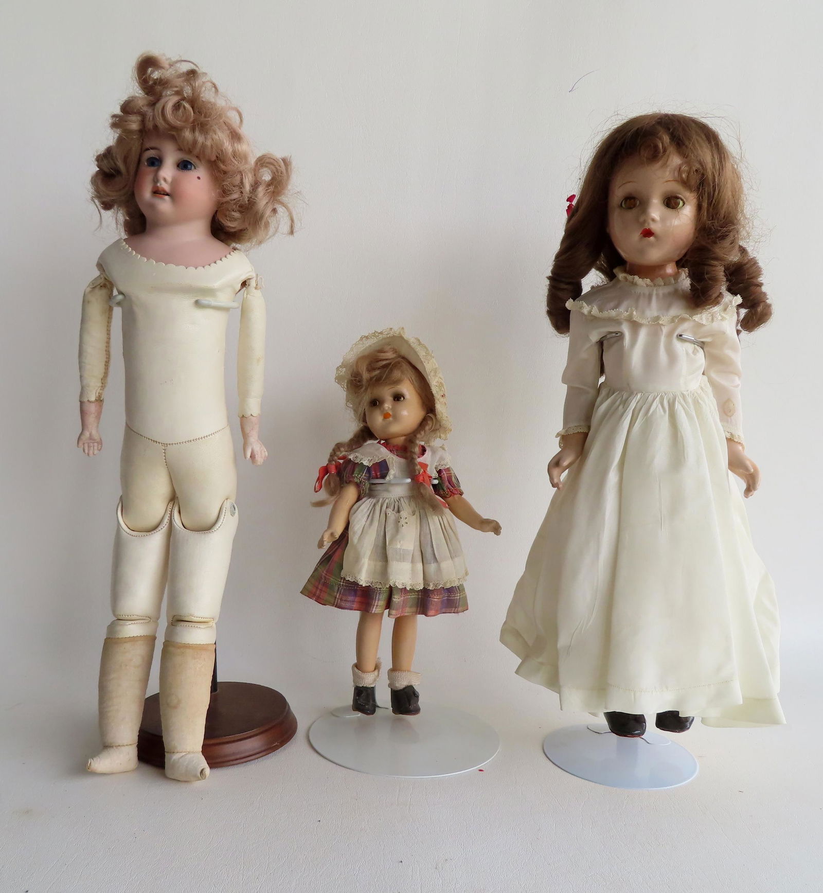 Three German dolls including: Peter Scherf bisque shoulder head doll with fixed eyes and cloth body, (1 of 19)