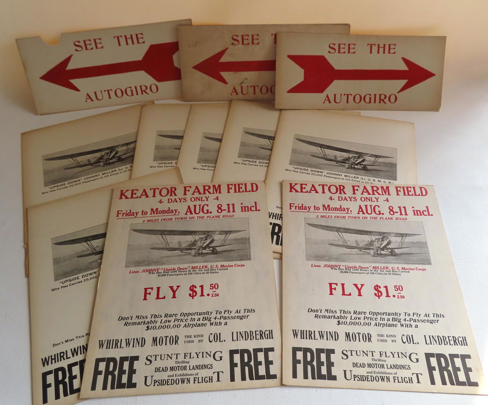 Grouping of 11 Captain John Miller aeronautical posters, circa 1930. Includes 8 barnstorming posters: Grouping of 11 Captain John Miller aeronautical posters, circa 1930. Includes 8 barnstorming posters showing Miller standing next to his aircraft - each 11" x 14", and 3 small arrow directional poster