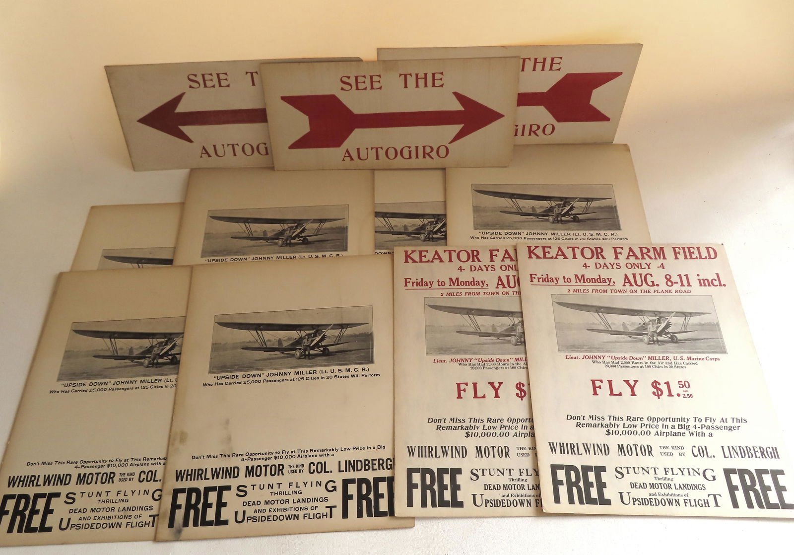 Grouping of 11 Captain John Miller aeronautical posters, circa 1930. Includes 8 barnstorming posters: Grouping of 11 Captain John Miller aeronautical posters, circa 1930. Includes 8 barnstorming posters showing miller standing next to his aircraft - each 11" x 14", and 3 small arrow directional poster