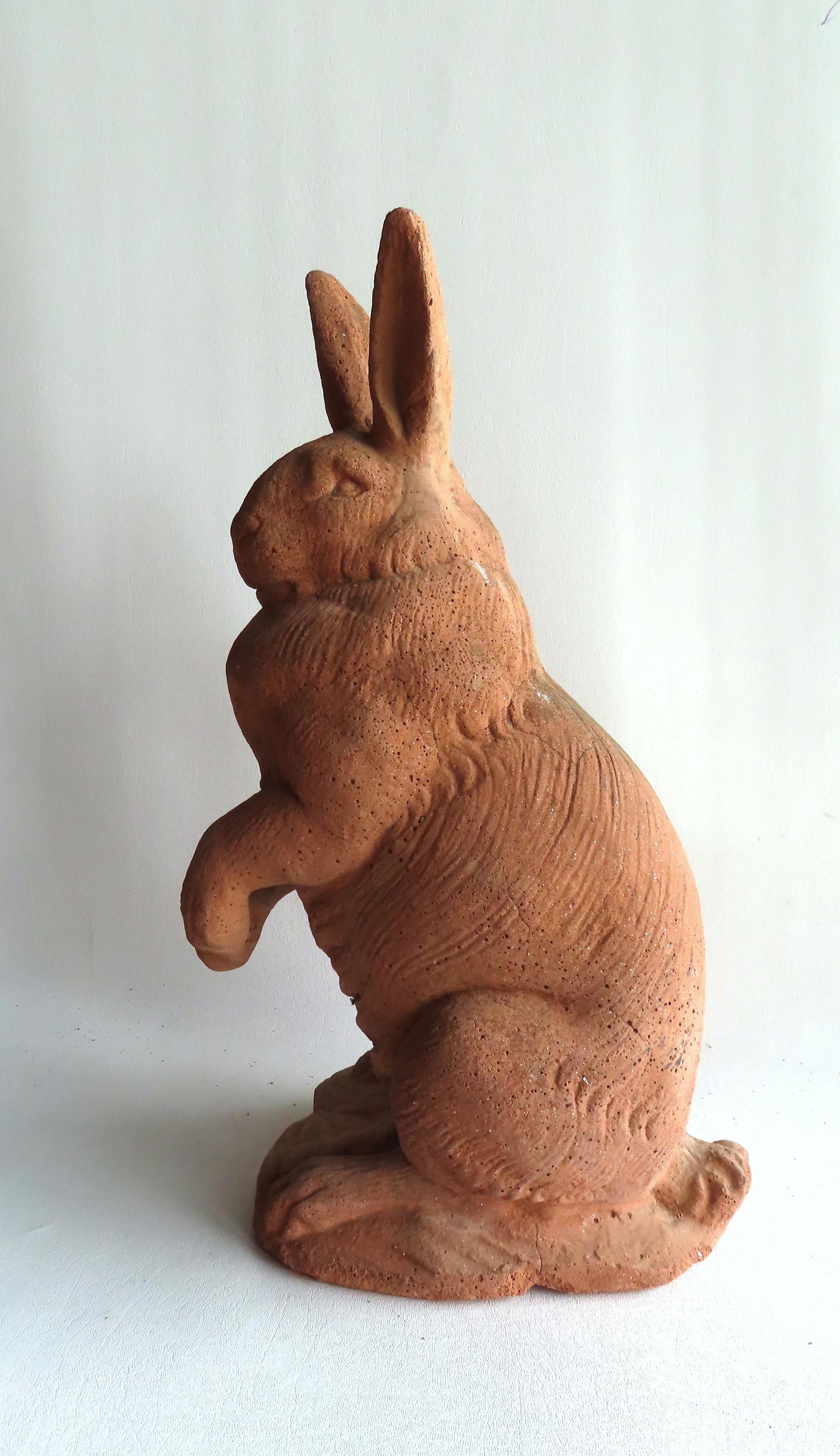 A large concrete or terra cotta molded rabbit, 19"H x 10"W, good condition. Late 20th c. (1 of 6)