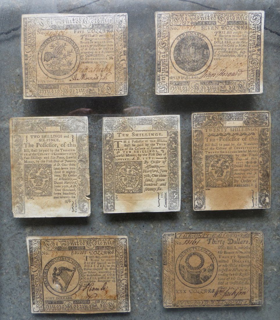 Seven framed 18th century continental money includi: Seven framed 18th century continental money including $7 printed by Hall & Sellers - Philadelphia 1776 signed John Howard, $5 printed by Hall & Sellers - Phila. 1775 signed A. Morris, $8 printed by Ha