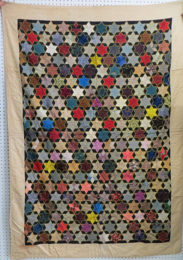 Graphic silk patchwork quilt in star pattern - some: Graphic silk patchwork quilt in star pattern - some fabric losses. Late 19th century. 4' 2" x 5' 11". Provenance: Estate of John Whiteford, Wassaic NY.