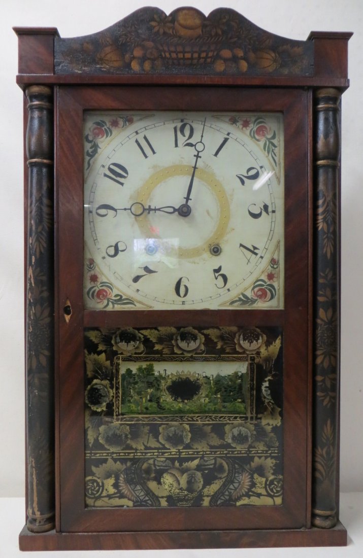 Stenciled shelf clock with bowl of fruit design on: Stenciled shelf clock with bowl of fruit design on top crest, hand painted half columns, signed Eli Terry CT. Note - repair to reverse painted lower tablet. All clocks sold as non-working.
