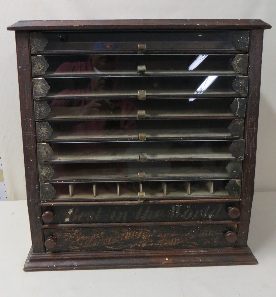 Spool cabinet with 8 glass-front doors over 2 wood: Spool cabinet with 8 glass-front doors over 2 wooden drawers - one wooden drawer inscribed "Best in the World", the other signed "The Brainerd & Armstrong Co." Circa 1870 - Original finish - 21.75"H x