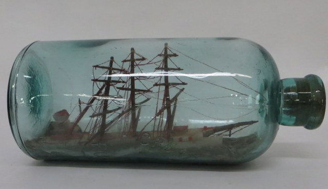 Old ship model in bottle.: Old ship model in bottle signed Great Bear Spring Fulton NY. Probably late 19th century. Bottle 11.5"H. Length of ship approximately 9".