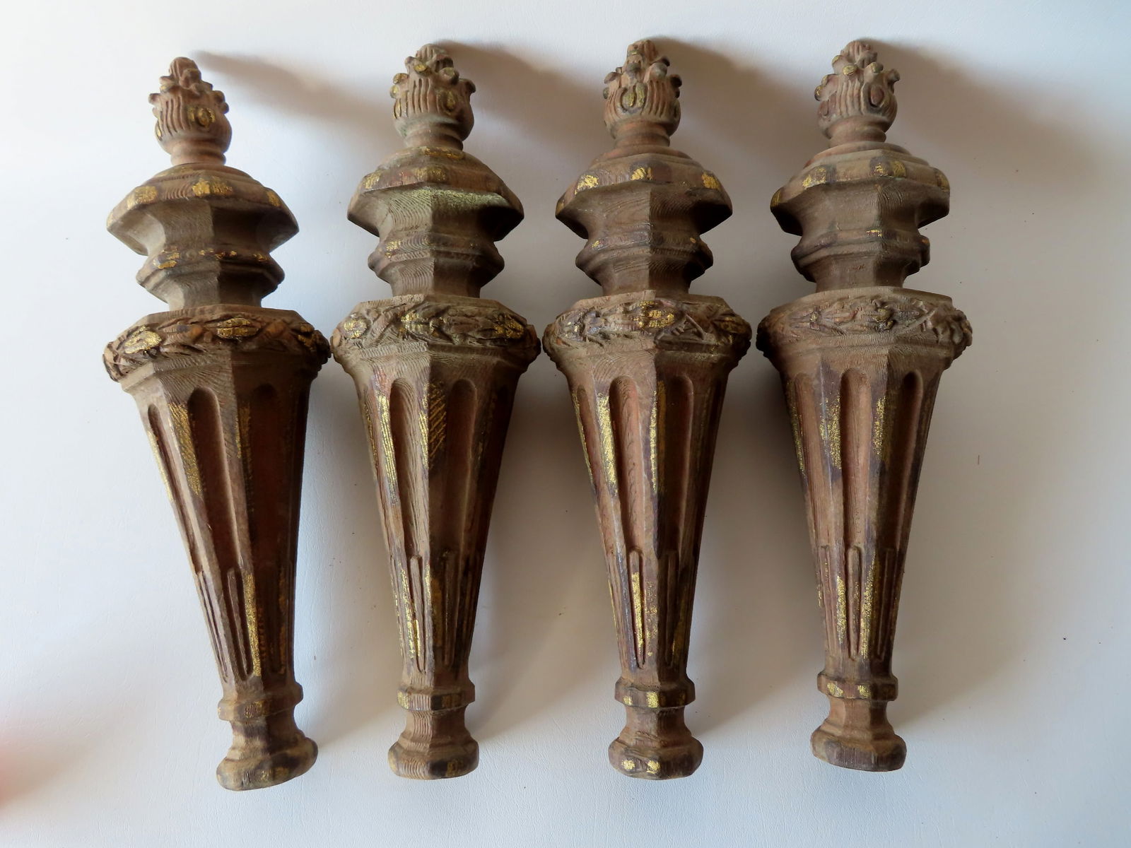 A set of 4 matching carved wooden ornaments with flame finials, 19th century, traces of original (1 of 6)