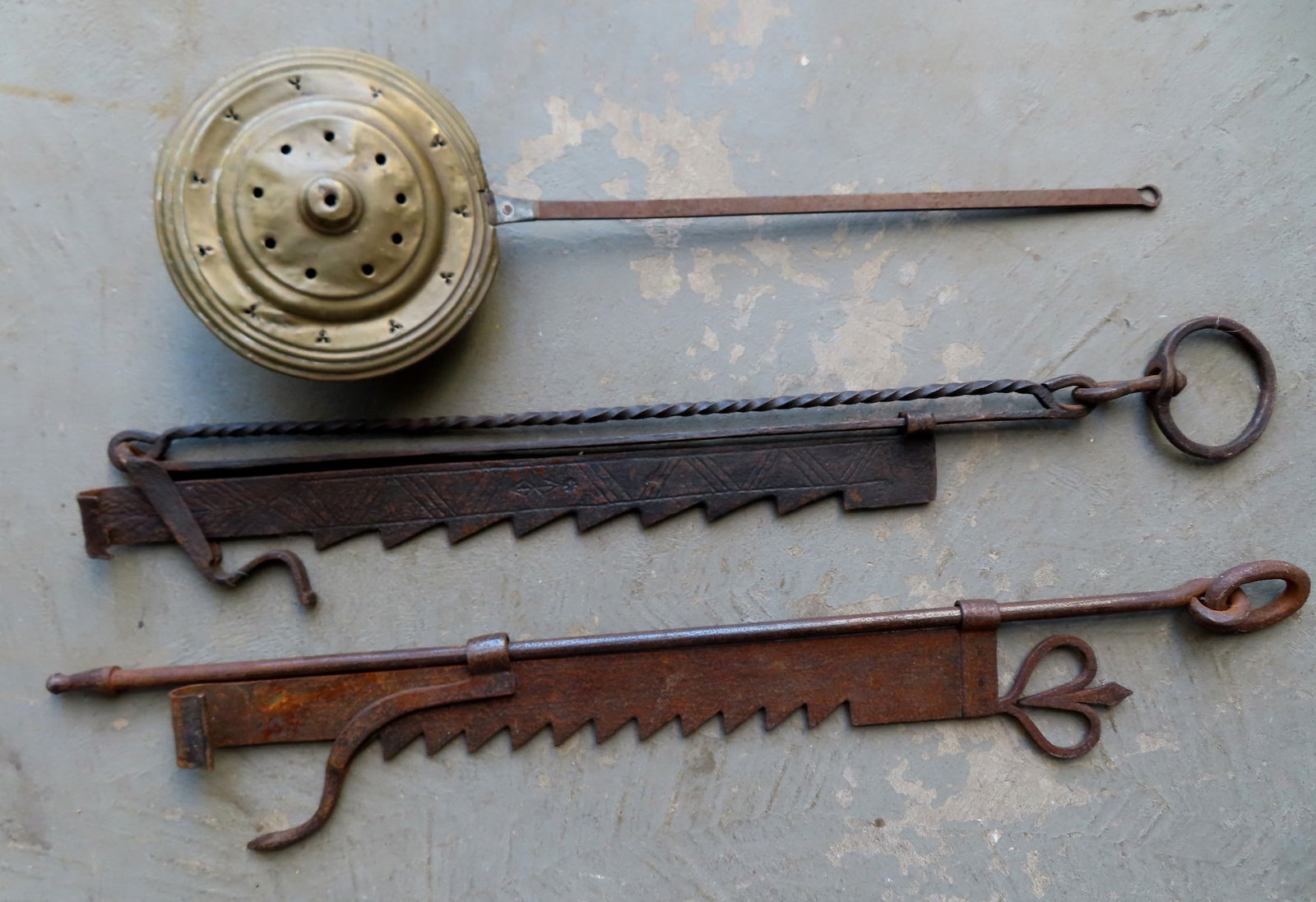 Grouping of 3 early hearth items including 2 hand forged iron adjustable trammels, 18th century, one (1 of 11)