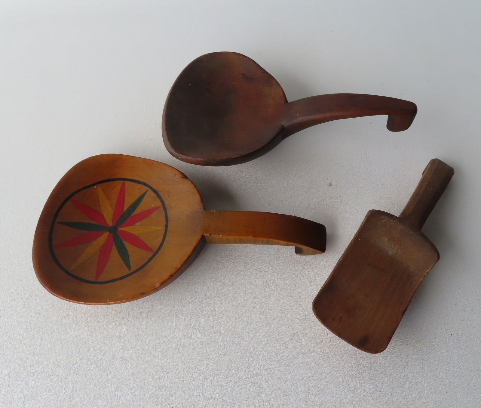 The carved wooden butter paddles, one with a shaped hand carved handle, and another in original (1 of 6)