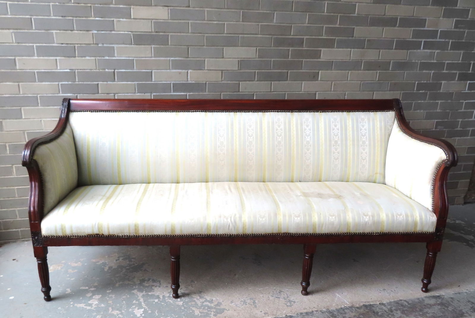 A classical Sheraton mahogany sofa with acanthus carving at top of scrolled arms with reeding, and (1 of 20)