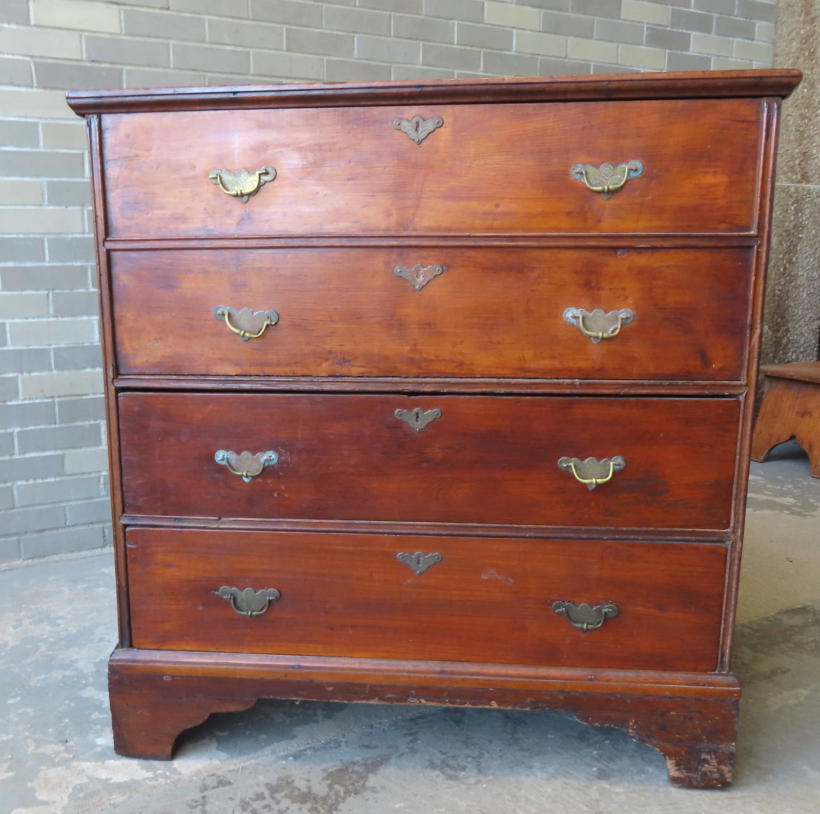 A refinished Hudson Valley Queen Ann blanket chest with 2 false drawers over 2 drawers mounted on: A refinished Hudson Valley Queen Ann blanket chest with 2 false drawers over 2 drawers mounted on bracket base. The lid with cotter pin hinges and the drawers all with matching batwing pulls decorated