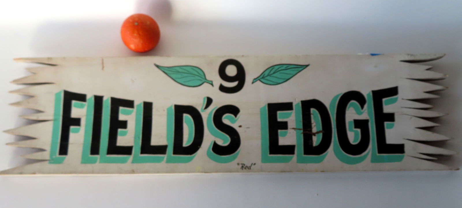 A rustic pine hand painted sign with shadow lettering in original black and green paint,  marked " 9 (1 of 4)