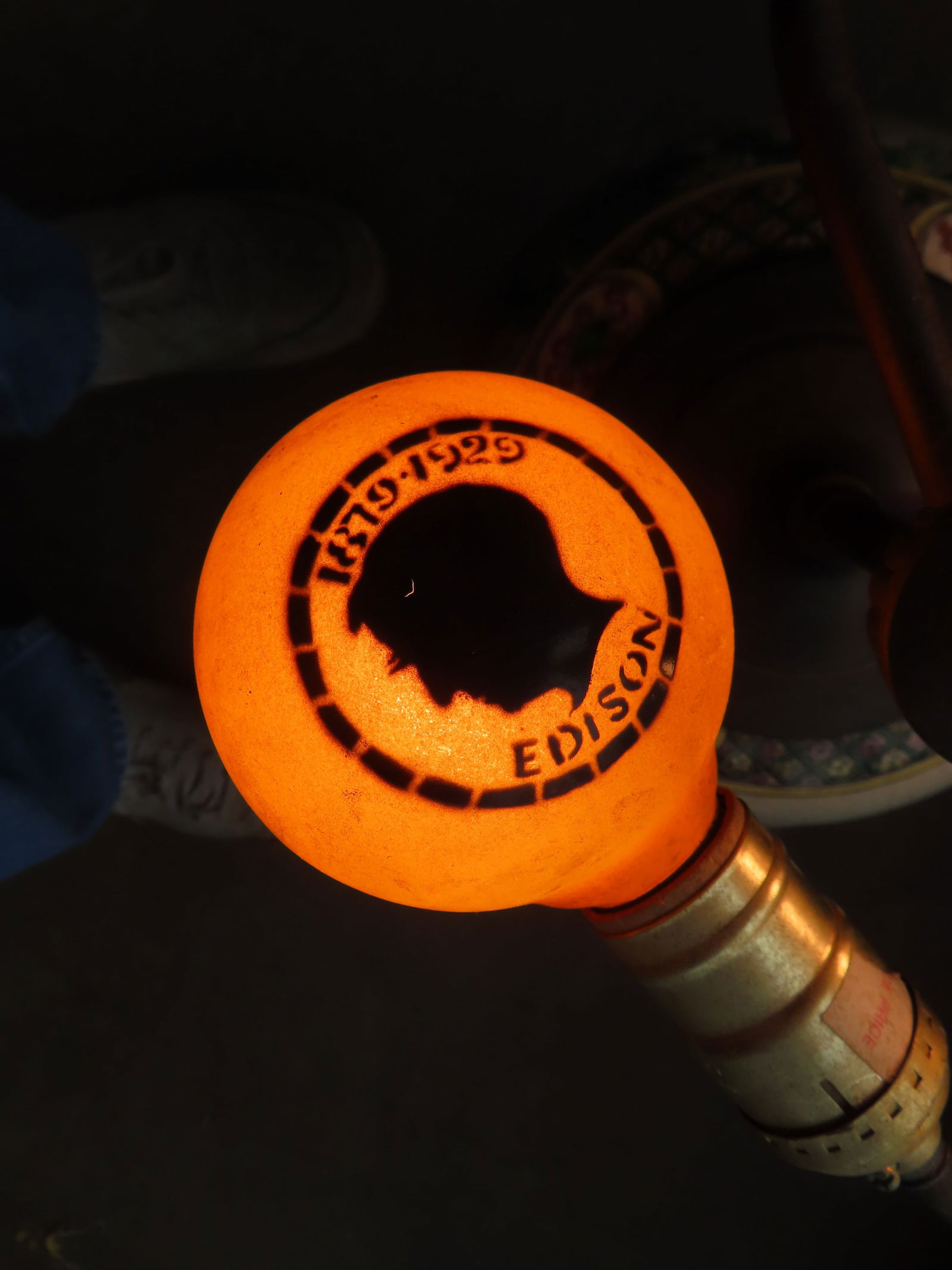 A rare Edison Golden Jubilee yellow light bulb with silhouette of Thomas Edison on the top and (1 of 7)